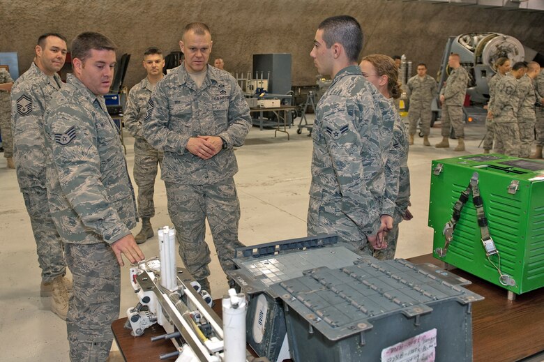 Chief Master Sgt. of the Air Force James A. Roy receives a briefing from Staff Sgt. James Heatherly about his role in maintaining aircraft weapons systems, Nov. 30, 2009. Chief Roy is touring the U.S. Air Forces Central Command area of responsibility, visiting with Airmen and addressing numerous issues affecting servicemembers who are deployed in support of operations Iraqi Freedom and Enduring Freedom. (U.S. Air Force photo/Staff Sgt. Robert Barney)