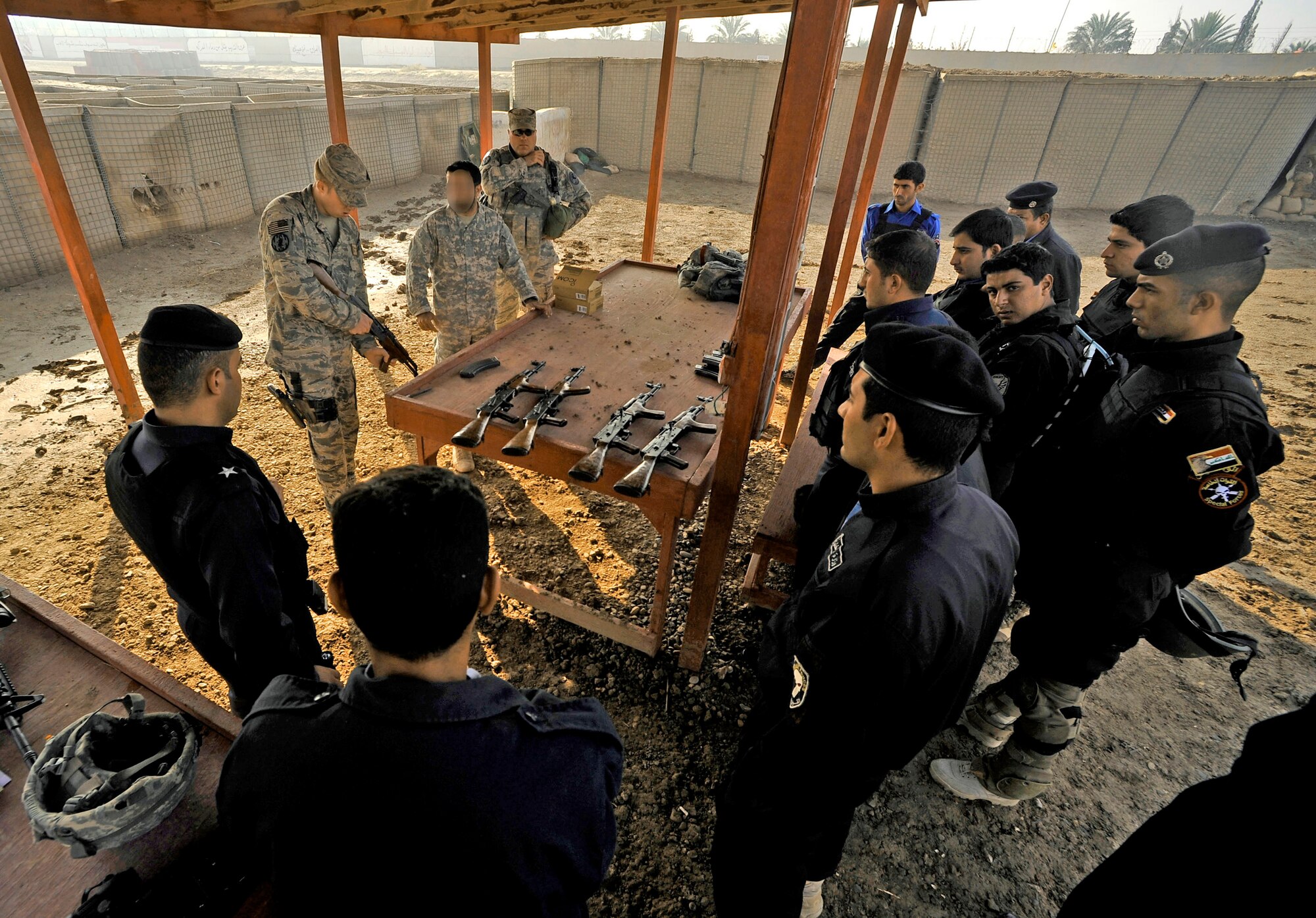 Staff Sgt. Michael Gomez instructs new Iraqi police officers at a firing range Nov. 21, 2009, in Baghdad, Iraq. Sergeant Gomez is assigned to the 732nd Expeditionary Security Forces Squadron Det. 2. (U.S. Air Force photo/Staff Sgt. Angelita Lawrence)