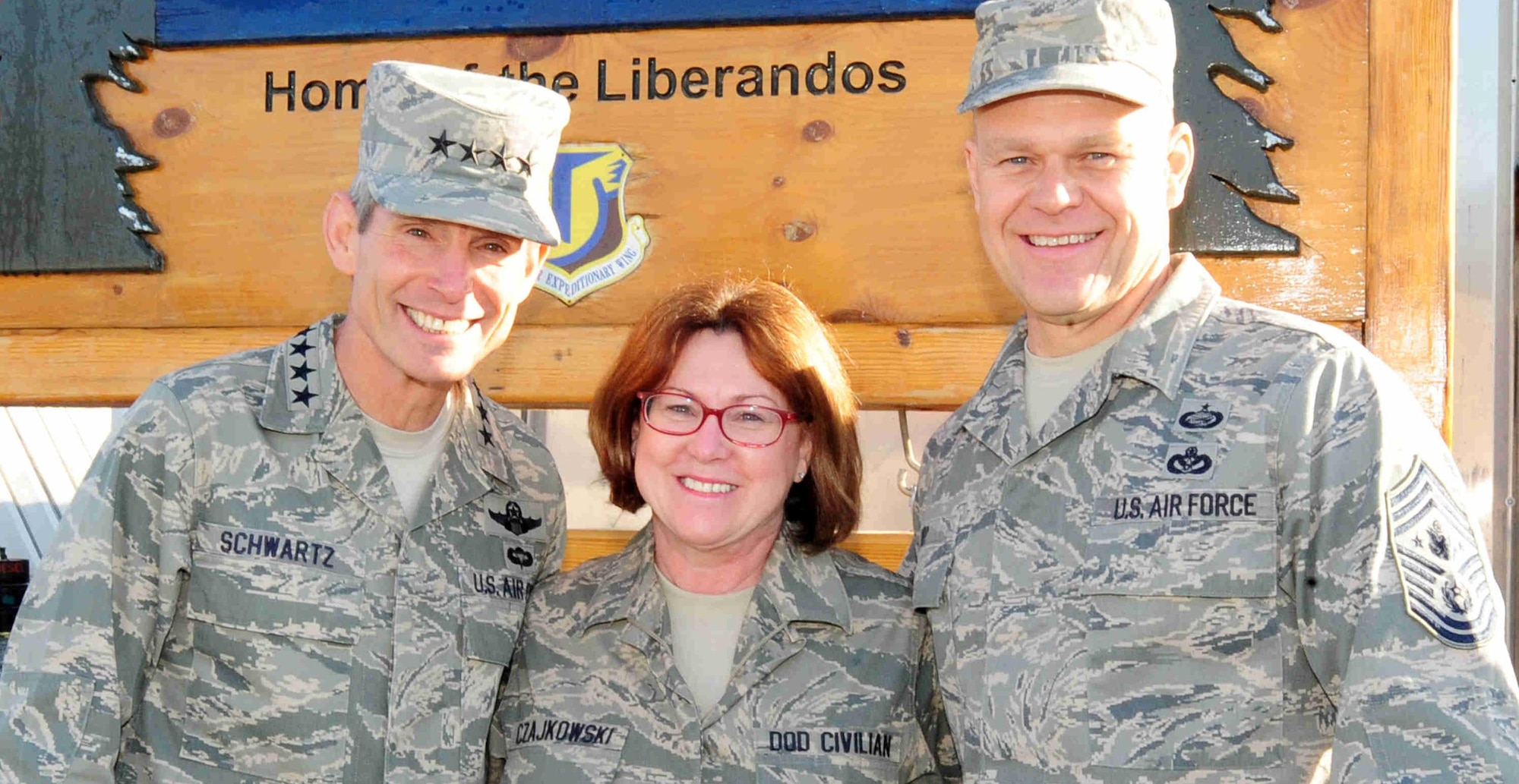 Ms. Debra Czajkowski (center), AFDW/A1S, is deployed as Chief of Protocol for Manas Transit Center, 376th AEW.  She  hosted the Air Force Chief of Staff General Norton Schwartz (left) and Chief Master Sgt. of the Air Force James Roy (right) during their visit to Manas on Thanksgiving Day. (U.S. Air Force photo.)
