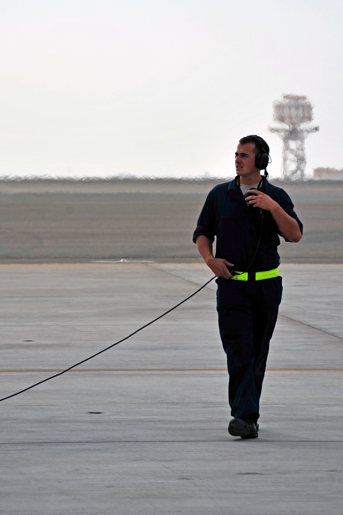UNITED ARAB EMIRATES AIR WARFARE CENTER, UAE - Senior Airman Adam Smith, 1st Fighter Wing crew chief, completes a last minute walk around of an F-22 Raptor before marshaling the aircraft Nov. 30, 2009. Airman Smith is on temporary duty from Langley Air Force Base, Va. Airman Smith hails from Boston, Mass. F-22 Raptors have deployed from the 1st Fighter Wing at Langley AFB, VA to the United Arab Emirates Air Warfare Center.  Aircrews have been participating in bilateral training opportunities with Coalition partners.  The exercises are designed to promote security, stability and mutual interests in the region.(U.S. Air Force photo/Tech. Sgt. Charles Larkin Sr)