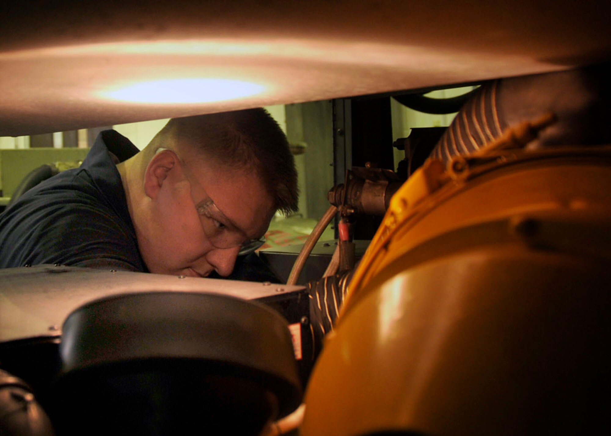 Airman 1st Class David Novak, 48th Equipment Maintenance Squadron Aerospace Ground Equipment apprentice reconnects electrical wires jack at the AGE shop on RAF Lakenheath, England, Nov. 24. Novak is working on the Red Team that is responsible for a wide range of equipment used on the flight line to maintain. (U.S. Air Force photo/Airman 1st Class Eboni Knox)