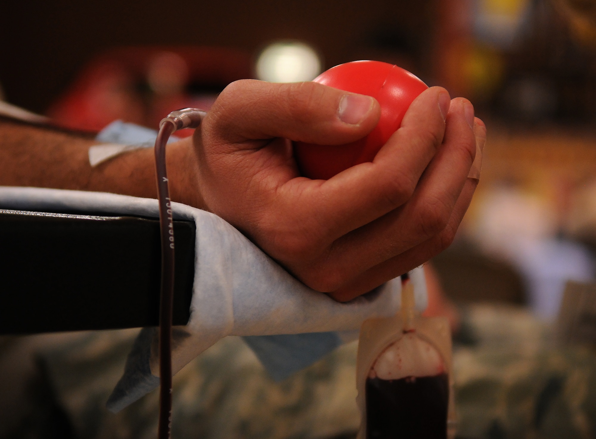 SPANGDAHLEM AIR BASE, Germany -- 2nd Lt. Gregory Stafford tries to relax while donating blood Dec. 2 at the Brick House. The Armed Services Blood Bank Center-Europe accepted blood donations here to provide blood products for servicemembers and their families around the world. Lieutenant Stafford is from the 52nd Communications Squadron. (U.S. Air Force photo/Airman 1st Class Nathanael Callon)