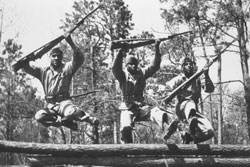 Montford Point Marines run an obstacle course