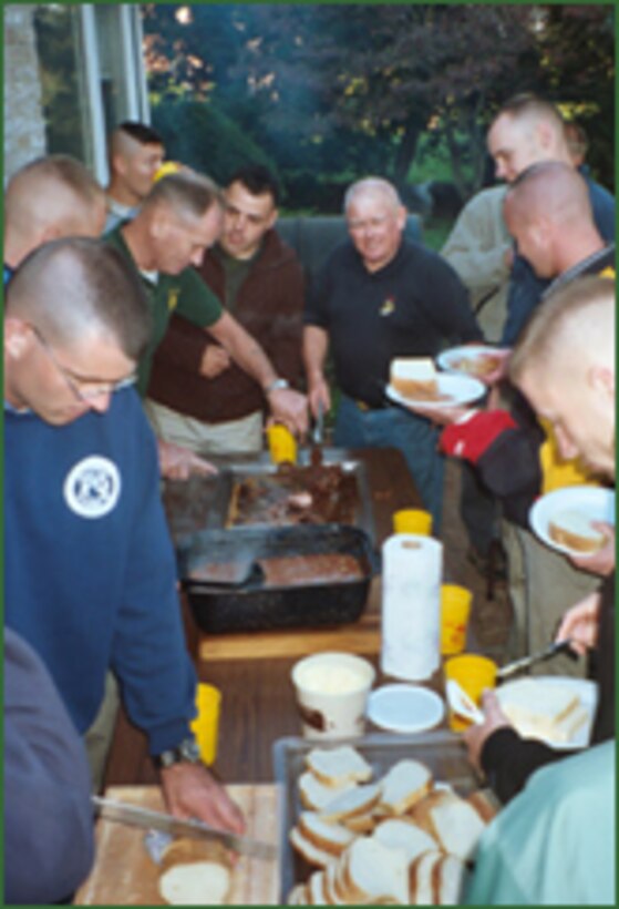 GETTYSBURG, Pa.?Seamus Garrahy (center right), former Marine, cooks steaks for Marines who visit his home in Gettysburg, Pa. Garrahy continually opens his home to Marines who visit Gettysburg. (Photo courtesy of www.gunghosauce.com). (RELEASED)