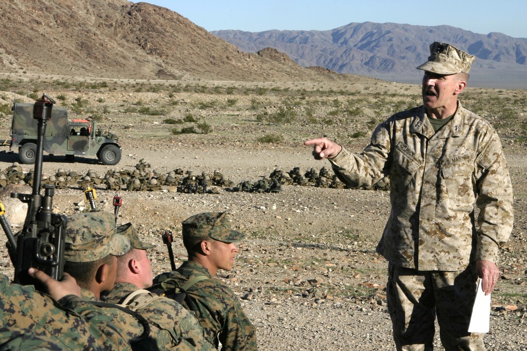 MARINE CORPS AIR-GROUND COMBAT CENTER TWENTYNINE PALMS, Calif. - Maj. Gen. Richard A. Huck, 2D Marine Division's commander, speaks to 1st Battalion, 6th Marine Regiment personnel during their Revised Combined Arms Exercise here.  The general briefed the troops on what to expect during their upcoming deployment to Iraq, and said noncommissioned officers, Staff NCOs and junior officer will win this counter-insurgency war.