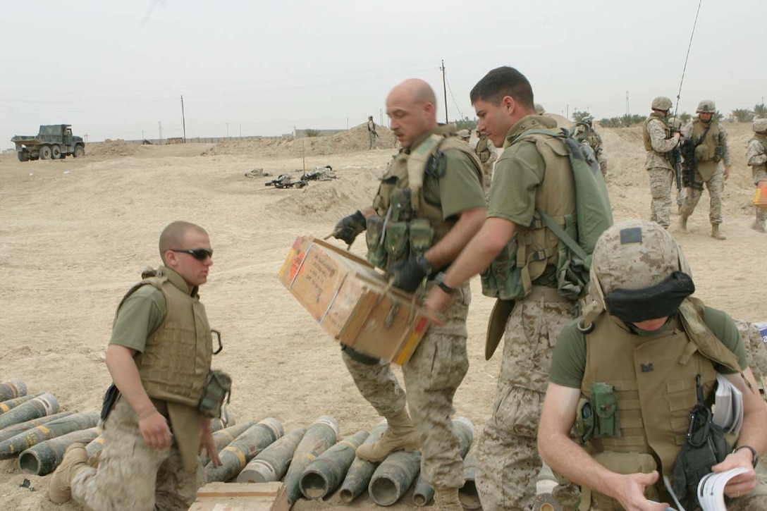 Marines from Combat Engineer Battalion, who are attached to 3rd Battalion 8th Marine Regiment, dug up the biggest cache found so far during operations in Iraq for the battalion.  The Marines dug for nearly three days uncovering thousands of pounds of weapons and ammunition.  Photo by Lance Cpl. Athanasios Genos