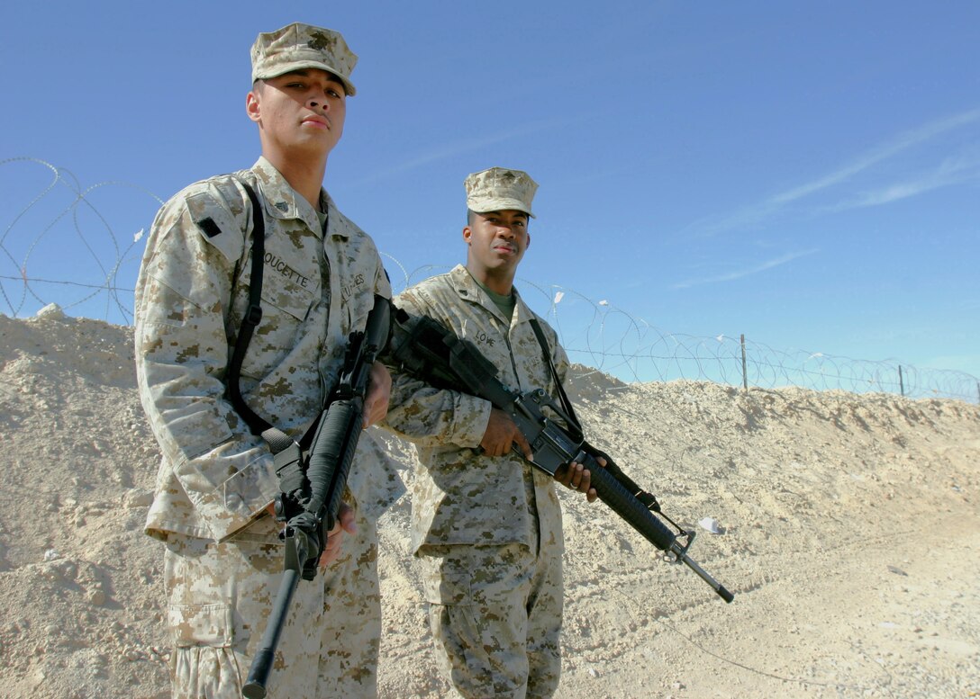 Marine Corps Air Base Al Asad, Al Anbar, Iraq-- New Orleans natives, 21-year-old Cpl. Kevin M. Doucette Jr. and Cpl. Chase H. Love,20, are both looking foward to return home after their mission in Iraq as radio operators for Regimental Combat Team-2 is complete. (Official USMC Photo by Cpl. Ken Melton 050305-M-3044M-0910)