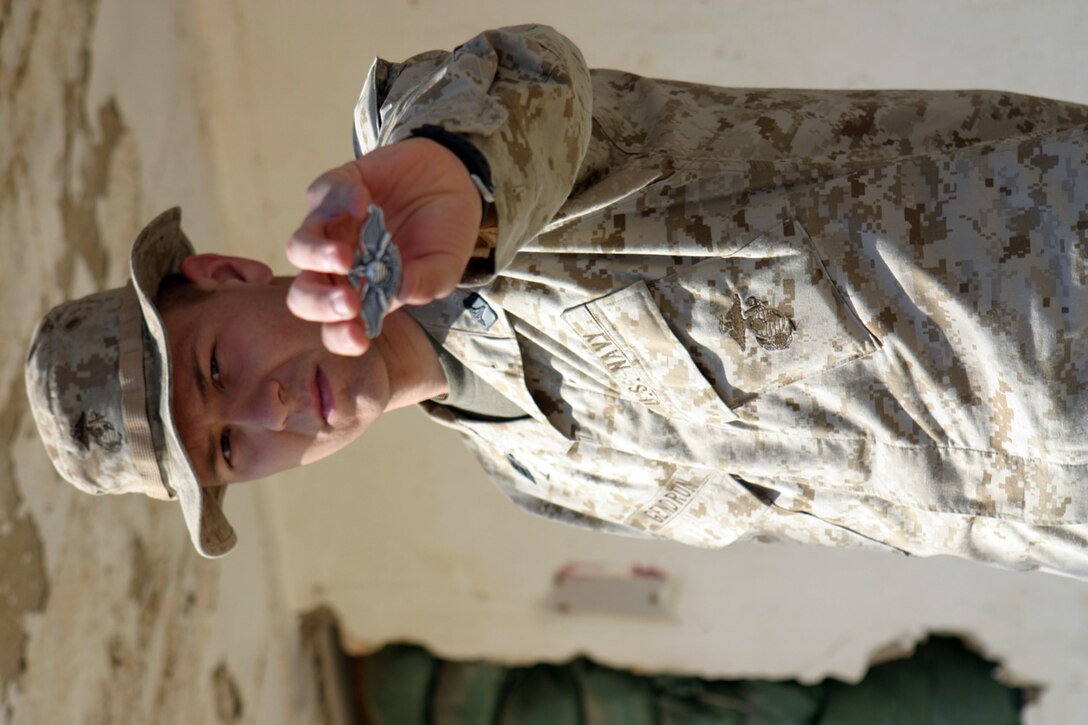 CAMP FALLUJAH, IRAQ – Hospitalman Joseph Gendron, a corpsman with 3rd Battalion, 8th Marine Regiment, was the most junior corpsman who earned his Fleet Marine Force pin in 2d Marine Division.  He is currently working with Truck Company as a corpsman with the Field Train.  Official U.S. Marine Corps photo by Lance Cpl. Athanasios L. Genos