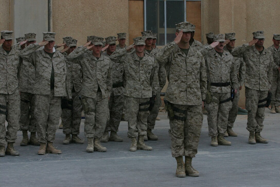 CAMP AL QA'IM, Iraq (March 22, 2005)- Marines with the security platoon of 3rd Battalion, 2nd Marine Regiment honor their fallen brother Lance Cpl. Kevin Smith who was killed in action by a vehicle borne improvised explosive device March 21. The Memorial ceremony took place here March 22. Official U.S. Marine Corps photo by Lance Cpl. Lucian Friel (RELEASED)