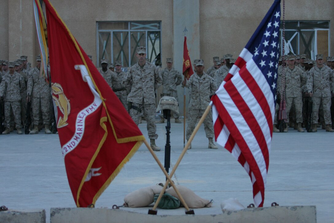 CAMP AL QA'IM, Iraq (March 22, 2005)- The Marines of 3rd Battalion, 2nd Marine Regiment honor their fallen brother Lance Cpl. Kevin Smith who was killed in action by a vehicle borne improvised explosive device March 21. The Memorial ceremony took place here March 22. The Battalion Chaplain Lt. John Anderson, along with the Marine's squad leader and platoon commander, gave a memorial speech in honor of Smith, who was with the battalion's security platoon. Official U.S. Marine Corps photo by Lance Cpl. Lucian Friel (RELEASED)