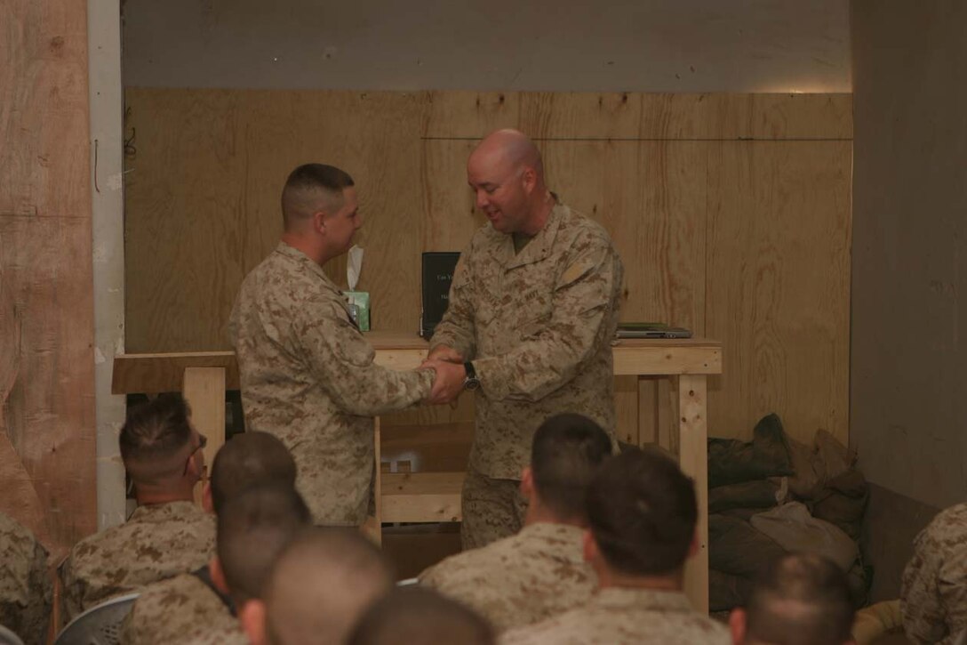 CAMP FALLUJAH, IRAQ – Battalion Chaplain Navy Lt. Robert E. Bradshaw, speaks during the Easter Sunday service using interaction with the Marines and sailors who attend the service.  Interaction with those who attend is one of the ways Bradshaw uses to teach his messages every Sunday.  Official U.S. Marine Corps photo by Lance Cpl. Athanasios L. Genos.