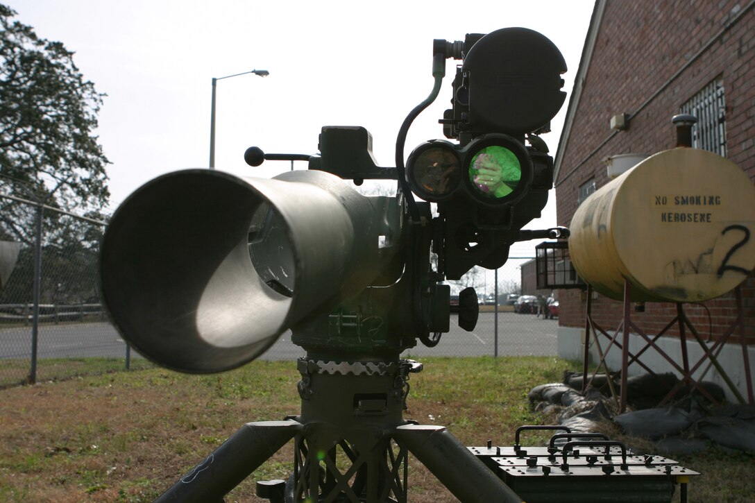 A tube-launched, optically tracked, wire guided missile system sits outside the armory of 2nd Battalion, 2nd Marine Regiment.  Lance Cpl. Nicholas B. Morrison was manning the same kind of weapon when he was killed Aug. 13 last year.  His comrades carry his memory today.  (Official U.S. Marine Corps photo by Cpl. Shawn C. Rhodes)