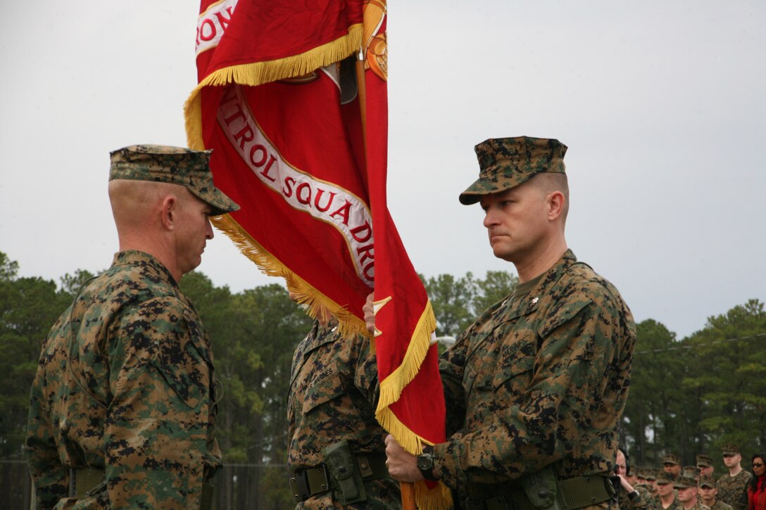 Lt. Col. Chris S. Richie, right, receives the squadron’s colors from Lt. Col. Matthew C. Culbertson in a change-of-command ceremony, Dec. 4. Richie now serves as the commanding officer of Marine Air Control Squadron 2.