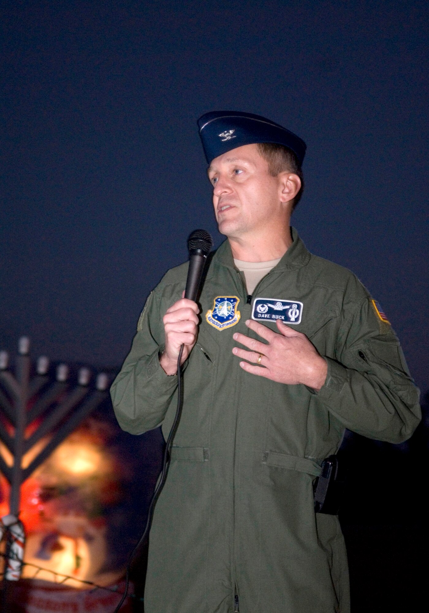 VANDENBERG AIR FORCE BASE, Calif. – Col. David Buck, the 30th Space Wing commander, speaks during the annual Holiday Tree Lighting Ceremony on Thursday, Dec. 3, 2009, outside of Building 11777. Colonel Buck started off the ceremony by stressing the importance of family members during the holiday. (U.S. Air Force photo/Senior Airman Ashley Reed)