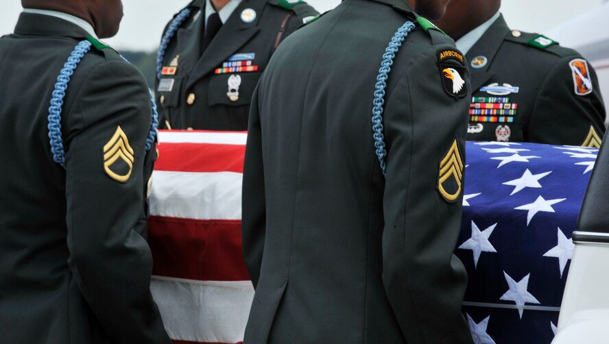 MOODY AIR FORCE BASE, Ga. -- Members of the 198th Infantry Honor Guard from Fort Benning, Ga., place Army Staff Sgt. Briand Williams, a fallen Soldier, into a hearse here Dec. 3. Sergeant Williams died Nov. 22, in Iraq, from wounds he sustained when insurgents attacked his unit using small arms fire. He was assigned to the 1st Battalion, 10th Field Artillery Regiment, 3rd Brigade Heavy Combat Team, 3rd Infantry Division at Fort Benning. (U.S. Air Force photo by Staff Sgt. Schelli Jones)