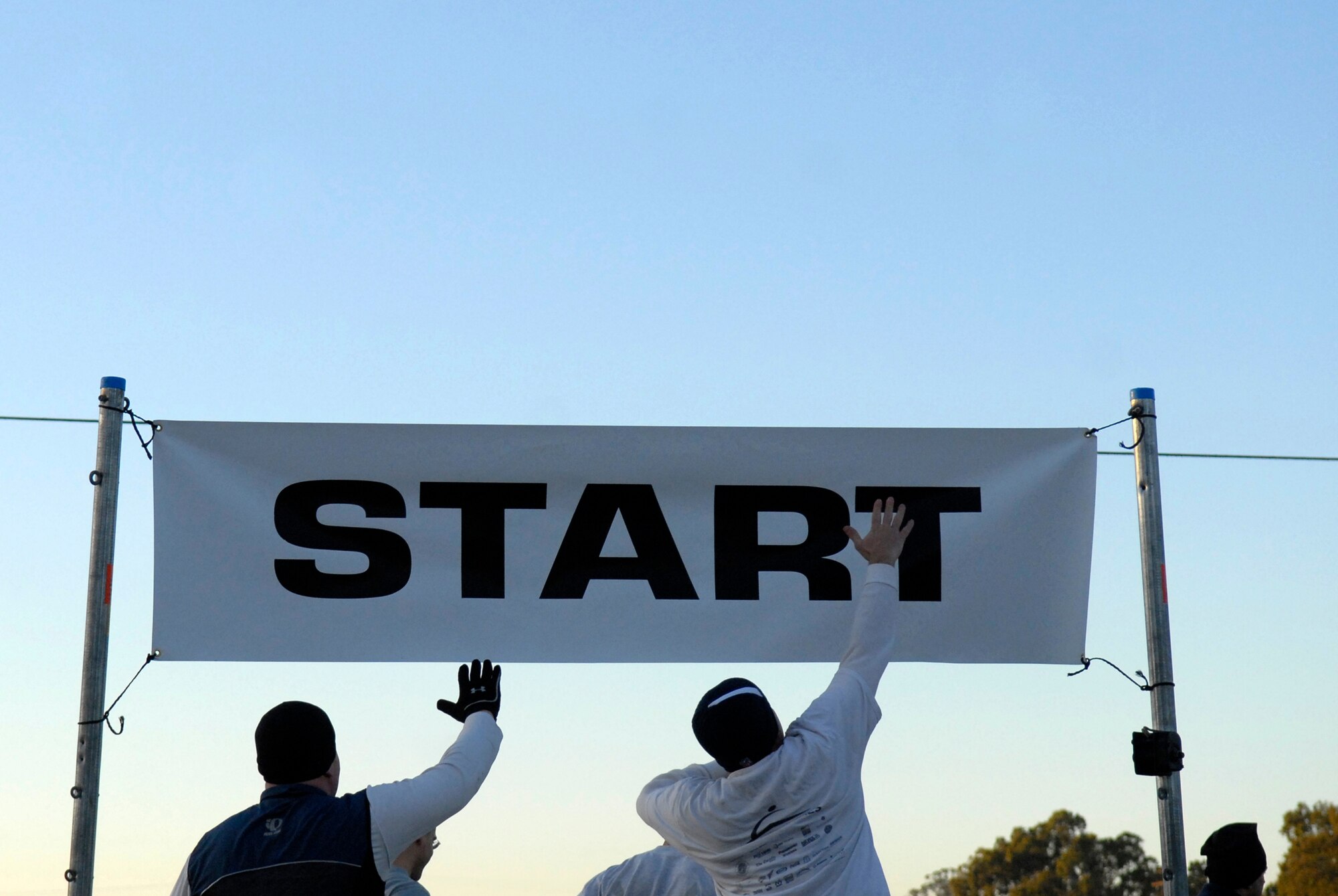 VANDENBERG AIR FORCE BASE, Calif. -- Airmen get started on the 10K Wingman Run here Friday, Dec. 4, 2009.  The day's events were meant to promote teamwork and taking care of fellow Wingmen.  (U.S. Air Force photo/Senior Airman Andrew Satran)