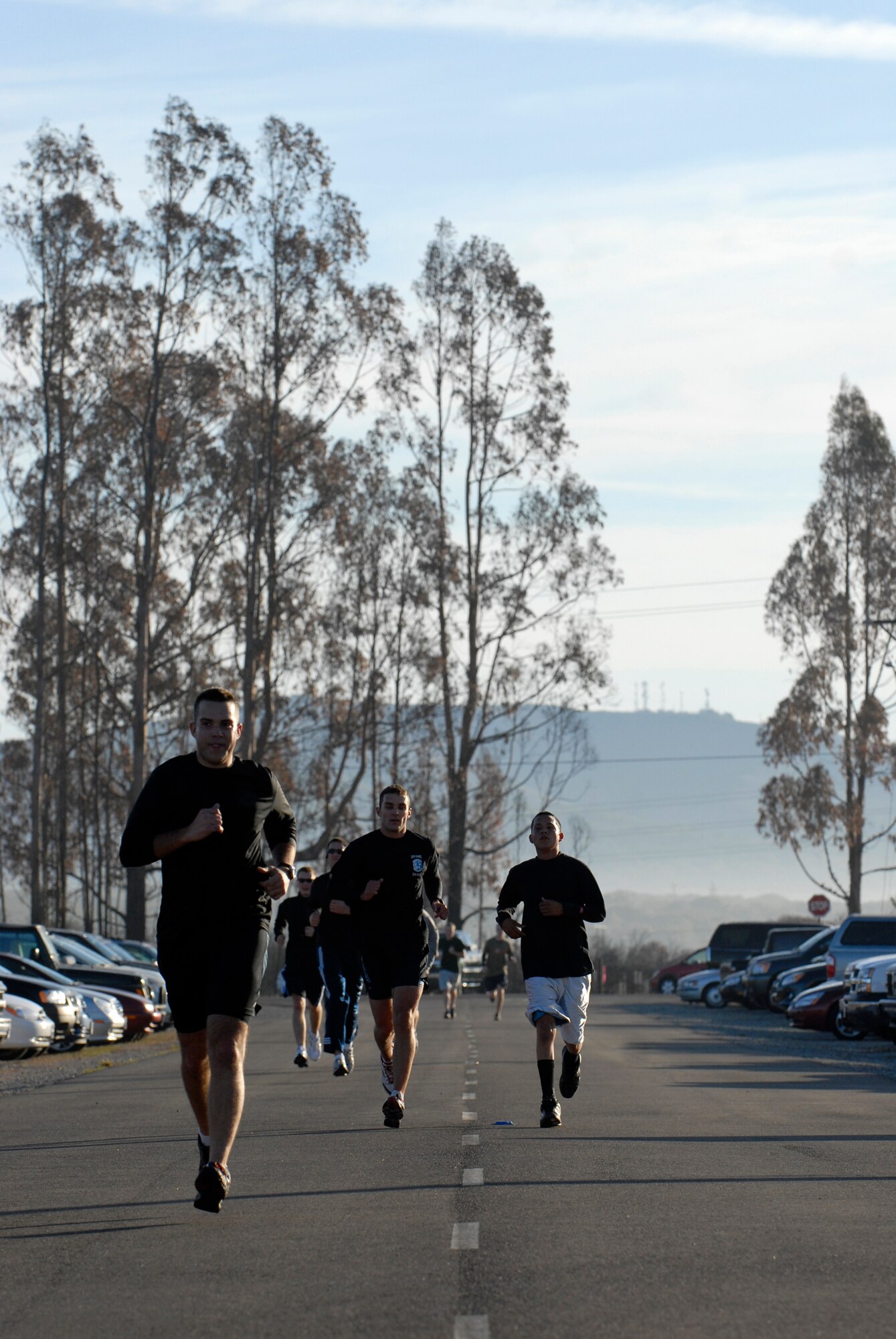 VANDENBERG AIR FORCE BASE, Calif. -- Airmen push through to the finish line during the 10K Wingman Day Run here Friday, Dec. 4, 2009.  The day's events were meant to promote teamwork and taking care of fellow Wingmen.  (U.S. Air Force photo/Senior Airman Andrew Satran)