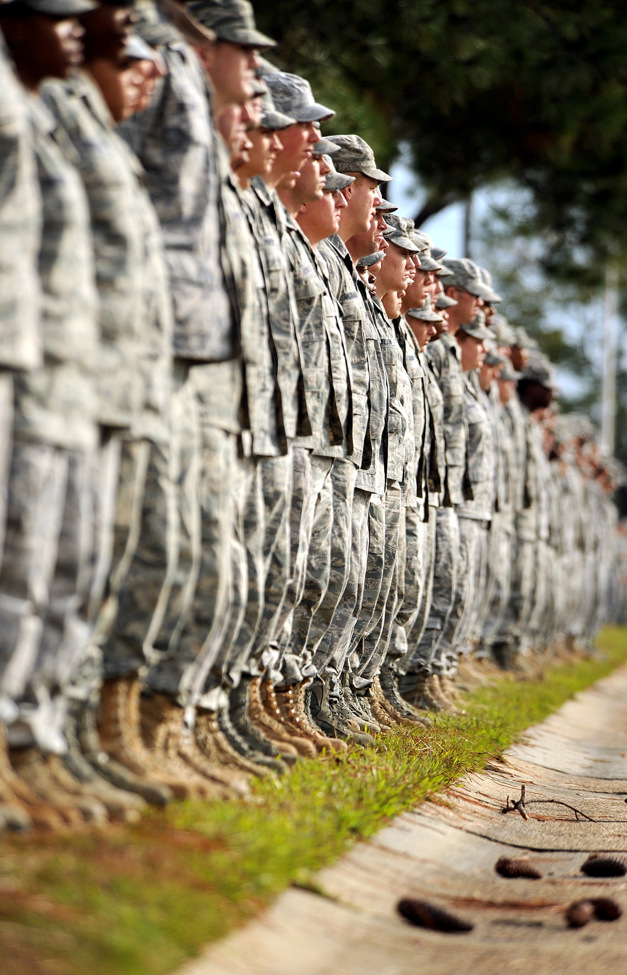 MOODY AIR FORCE BASE, Ga. -- Airmen from the 824th Security Forces Squadron, await the order of attention during a dignified transfer for U.S. Army Staff Sgt Briand T. Williams fallen soldier from Fort Benning, Ga. here Dec. 3. Sergeant Williams was killed in action when his unit was attacked by insurgents while deployed in support of operation freedom. (U.S. Air Force photo by Airman 1st Class Joshua Green)
