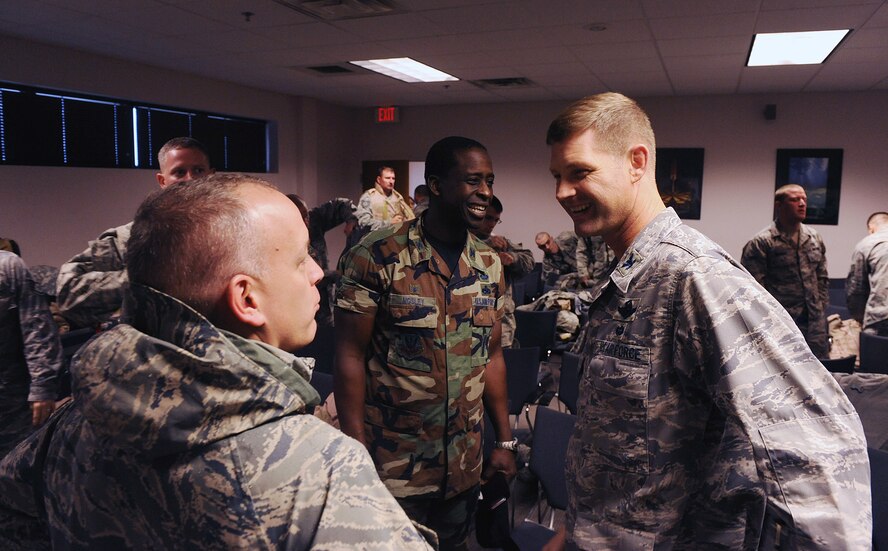 MOODY AIR FORCE BASE, Ga. -- (Right) Col. Gary Henderson, 23rd Wing commander, speaks with other commanders from the wing during a deployment of Moody members here Dec. 2. The Airmen being deployed from Moody are headed to Iraq for a six-month deployment. (U.S. Air Force photo by Airman 1st Class Joshua Green)