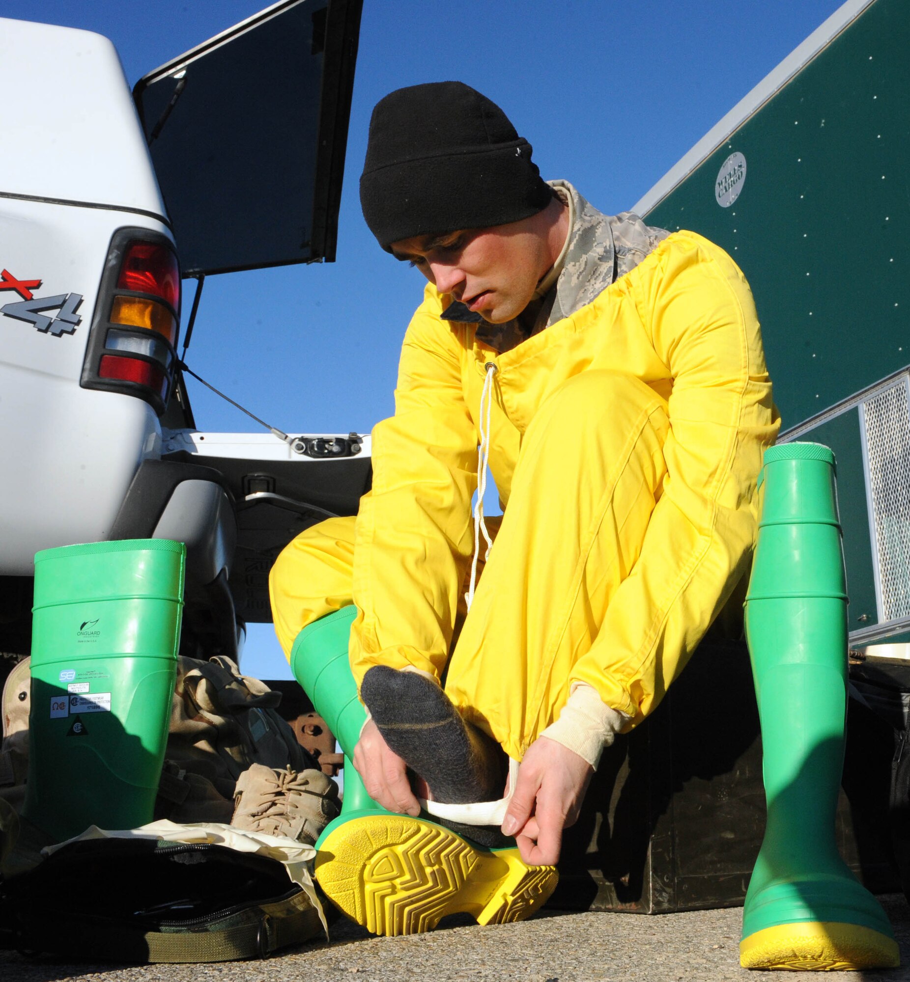 MOUNTAIN HOME AIR FORCE BASE, Idaho -- Staff Sgt. James Adams 366th Civil Engineer Squadron explosive ordinance disposal team member, puts on a protective radiation suit in response to a simulated C-17 Globemaster crash during an emergency management exercise Dec. 2. The 366th Fighter Wing conducts exercises to prepare first responders and wing personnel for a variety of possible emergencies and accidents. (U.S. Air Force photo by Airman 1st Class Debbie Lockhart)