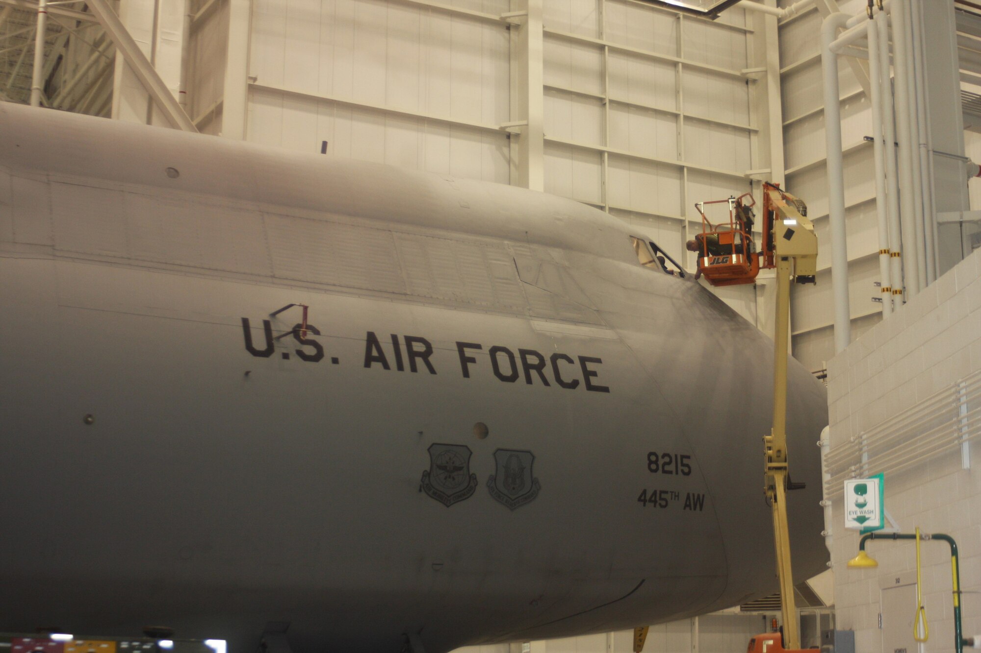 WRIGHT-PATTERSON AIR FORCE BASE, Ohio – Staff Sgt. Mike Benzing, 445th Aircraft Maintenance Squadron crew chief, does some repair work around the nose of a C-5 Galaxy aircraft during an isochronal inspection Nov. 12.  ISO inspections are thorough examinations of the entire aircraft where aircraft maintainers look for and repair problems in every system, from nose to tail and wingtip to wingtip. (U.S. Air Force photo/Stacy Vaughn)