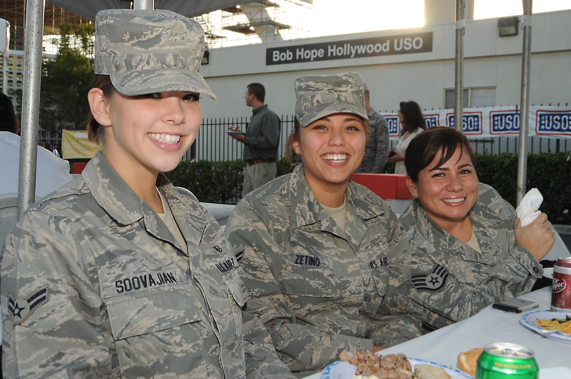 (left to right) Airman 1st Class Linsy Soovajian, Airman 1st Class Eliza Zetino and Staff Sgt. Aida Tappan, all from 61st Medical Group, enjoy their free meal during the Bob Hope Hollywood USO's “Salute to Our Military Personnel” at the Los Angeles International Airport, Nov. 24.  Local and other military troops passing through LAX were treated to an afternoon of pre-Thanksgiving lunch and entertainment.  (Photo by Joe Juarez)