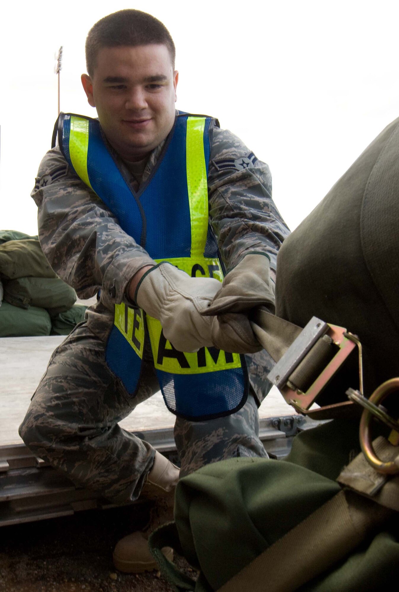LANGLEY AIR FORCE BASE, Va. -- Airman 1st Class James Pirner, Baggage Team member, secures a pallet during a Phase I Operational Readiness Exercise Dec. 3. Wing Exercise Evaluation Team members will assess the ability of 1st Fighter Wing units to deploy cargo, aircraft and Airmen within a limited timeframe. (U.S.  Air Force photo/Staff Sgt. Barry Loo)