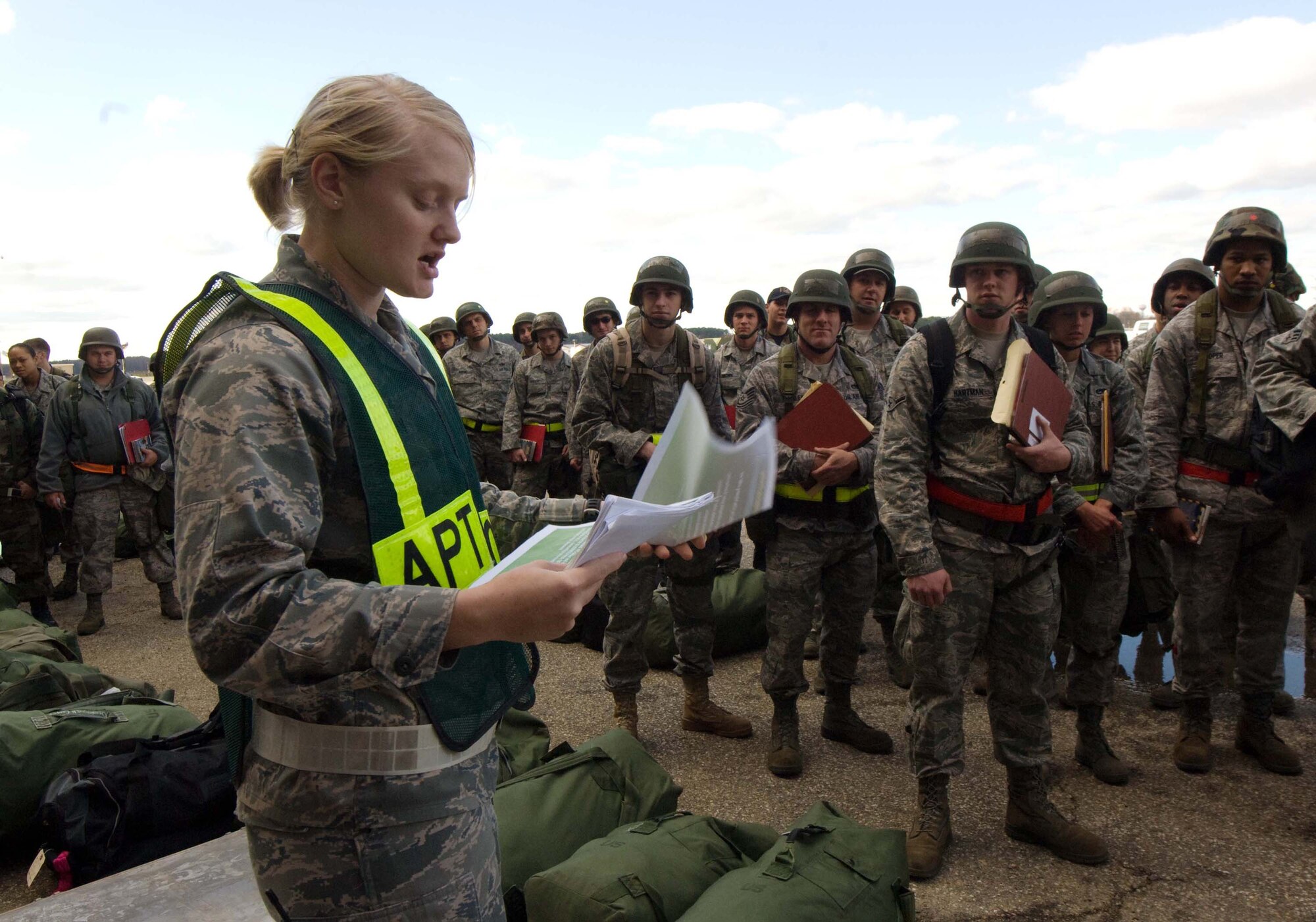 LANGLEY AIR FORCE BASE, Va. -- Second Lt. Kady Rohan, Air Passenger Terminal officer in charge, briefs Langley personnel before they process the deployment line during a Phase I Operational Readiness Exercise Dec. 3. Wing Exercise Evaluation Team members will assess the ability of 1st Fighter Wing units to deploy cargo, aircraft and Airmen within a limited timeframe. (U.S.  Air Force photo/Staff Sgt. Barry Loo)