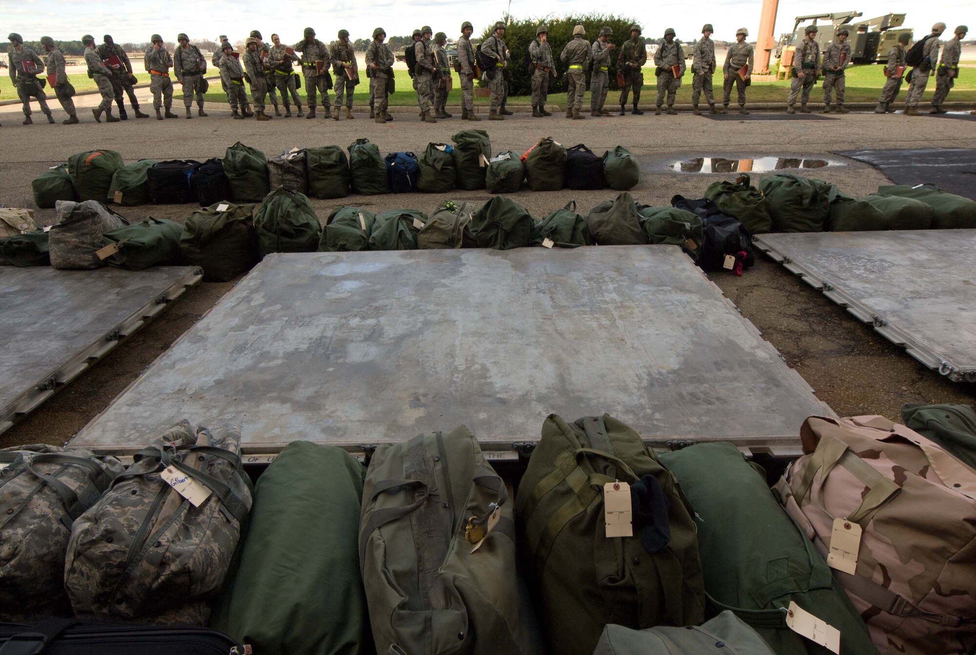 LANGLEY AIR FORCE BASE, Va. -- Langley personnel assemble for deployment processing during a Phase I Operational Readiness Exercise Dec. 3. Wing Exercise Evaluation Team members will assess the ability of 1st Fighter Wing units to deploy cargo, aircraft and Airmen within a limited timeframe. (U.S.  Air Force photo/Staff Sgt. Barry Loo)