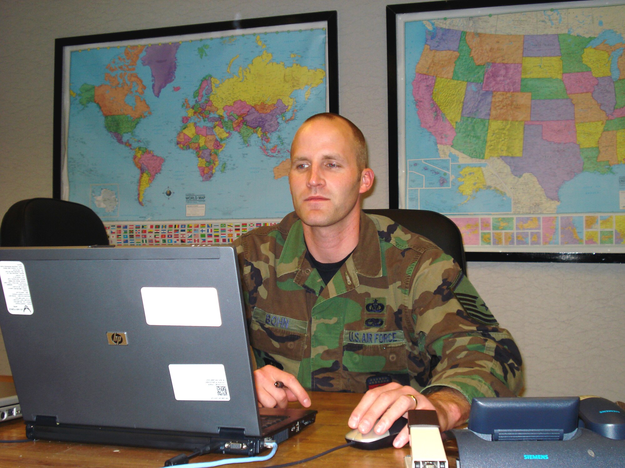 WRIGHT-PATTERSON AIR FORCE BASE, Ohio – Master Sgt. Bryan Bohn, 445th Airlift Wing Command Post controller, tracks reports that provide a snap shot of 445th Airlift Wing activities that are important to the commander. One of the many tasks of the command post controllers is that they are the point of contact from higher headquarters, a funnel for time sensitive information that flows between the commander and his boss. (U.S. Air Force photo/Senior Airman Mikhail Berlin)