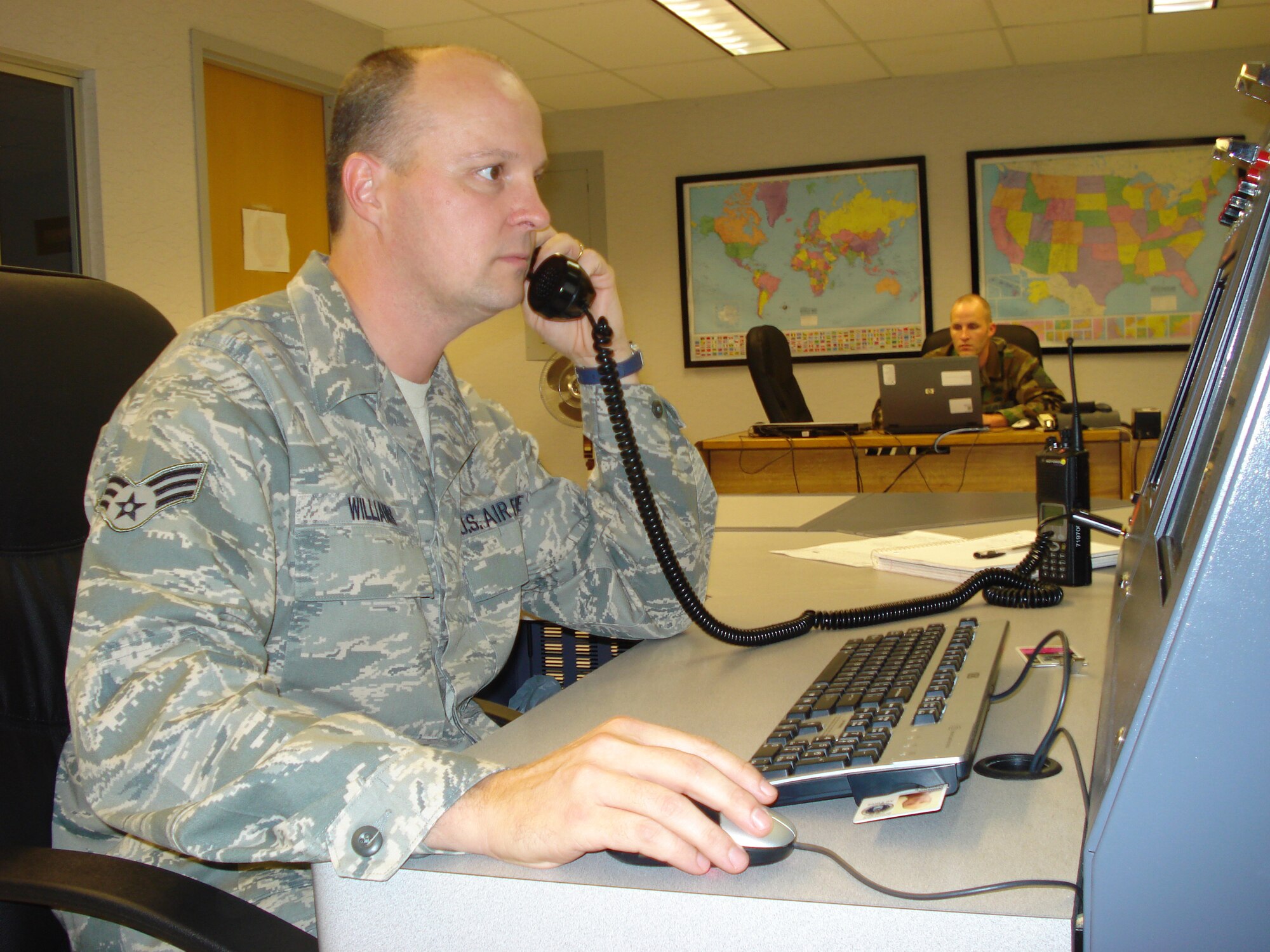 WRIGHT-PATTERSON AIR FORCE BASE, Ohio – Senior Airman Frank Williams, 445th Airlift Wing Command Post controller, routinely fields information calls as well as keeping in constant contact with off station 445th Airlift Wing C-5 Galaxy aircraft. Command Post controllers support the mission and help people, whether it’s a stranded logistics readiness unit stuck in Germany trying to get home, or an Airman Basic who calls in not knowing where to report. (U.S. Air Force photo/Senior Airman Mikhail Berlin)