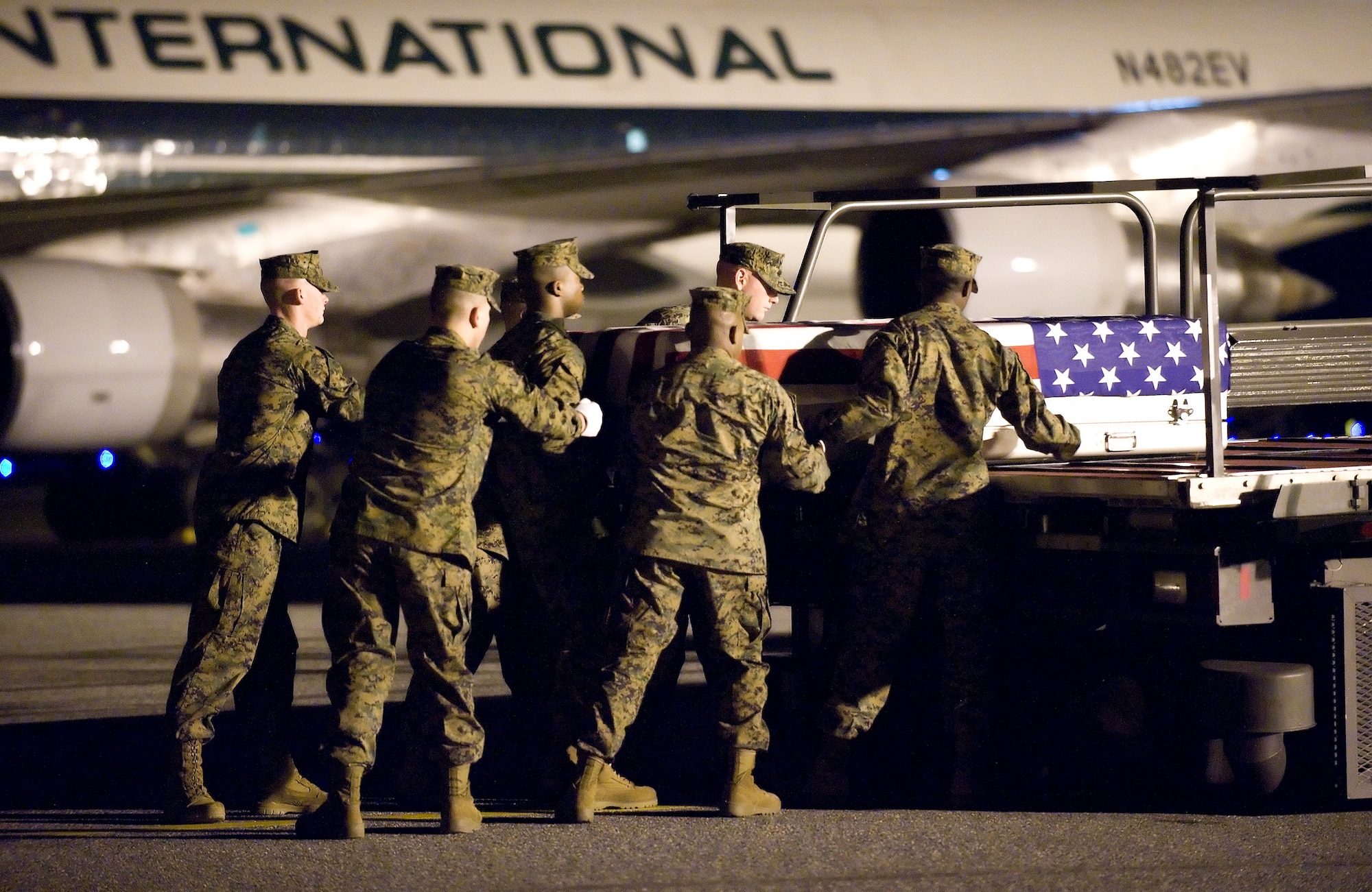 3 December 2009  USAF Photo by Jason Minto.  A U.S. Marine Corps carry team transfers the remains of Marine LCPL Jonathan Taylor., of Jacksonville, FL., at Dover Air Force Base, Del., Dec 3, 2009.  He was assigned to 2nd Battalion, 2nd Marine Regiment, 2nd Marine Division, II Marine Expeditionary Force, Camp Lejeune, N.C.