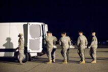 3 December 2009  USAF Photo by Jason Minto.  A U.S. Army carry team transfers the remains of Army CPL Kenneth R. Nichols Jr., of Chrisman, IL., at Dover Air Force Base, Del., Dec 3, 2009.  
