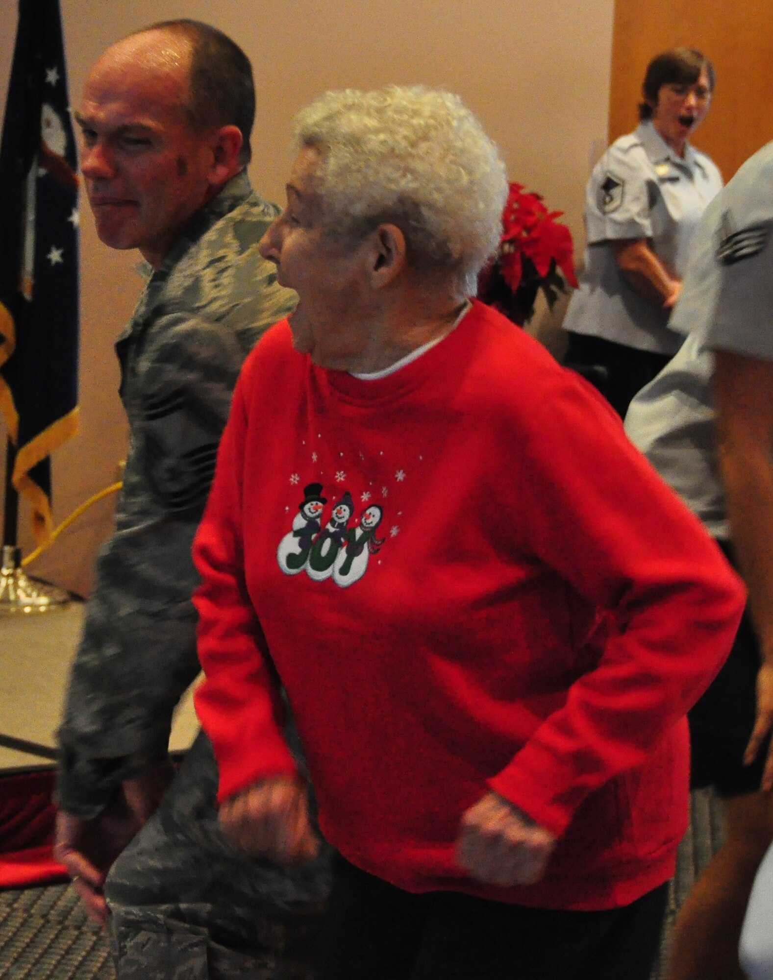 Senior Master Sgt. Travis Fritts, 325th Force Support Squadron Career Assistant Advisor, danced with a guest at the 23rd annual Golden Age Holiday Party Dec. 2 at the Heritage Club. (U.S. Air Force photo by Airman 1st Class Rachelle Elsea)
