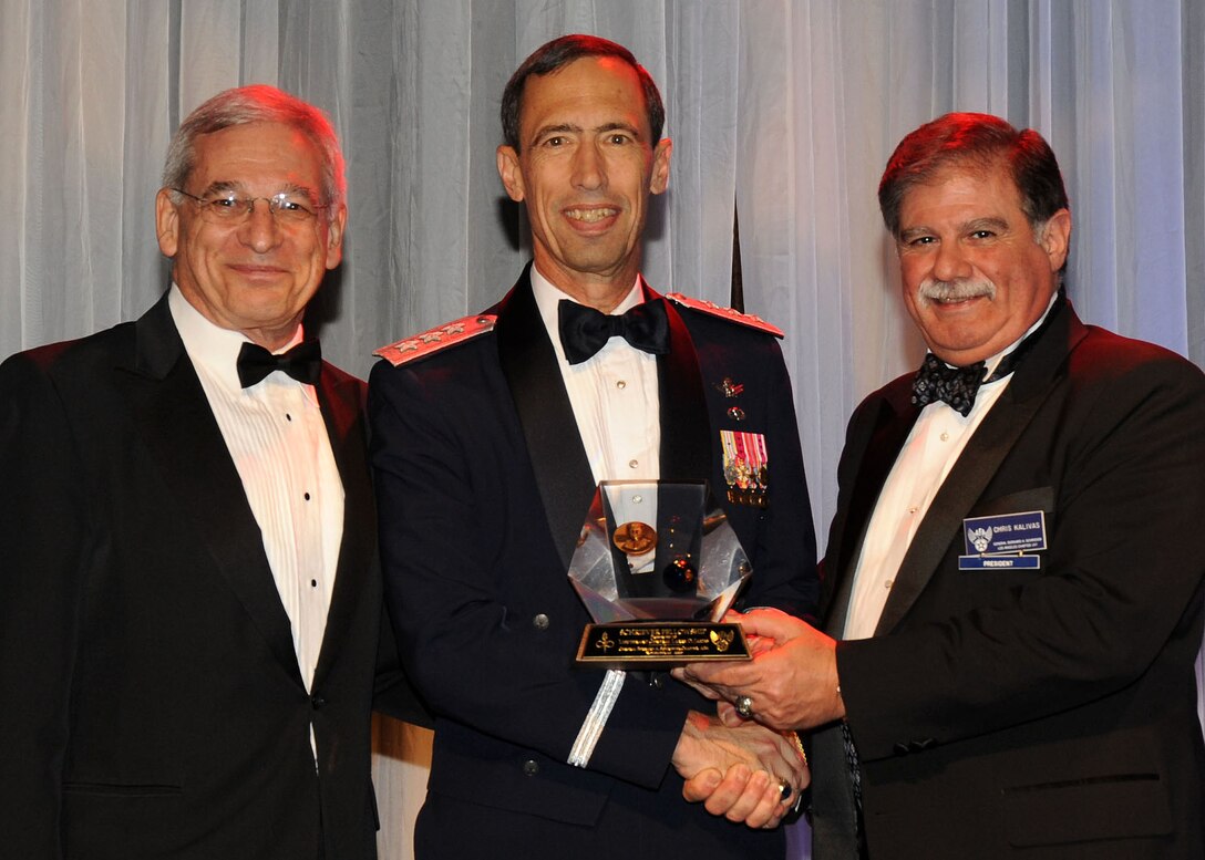 Lt. Gen. Larry James (center), 14th Air Force commander, Vandenberg Air Force Base, Calif., receives the General Bernard A. Schriever Fellowship Award during the 38th annual Air Force Association Ball held in Beverly Hills, Nov. 20.  Presenting the award are Sanford “Sandy” Schlitt (left), AFA Aerospace Education Council chairman, and Mr. Chris Kalivas, local AFA Chapter 147 president. (Photo by Lou Hernandez)