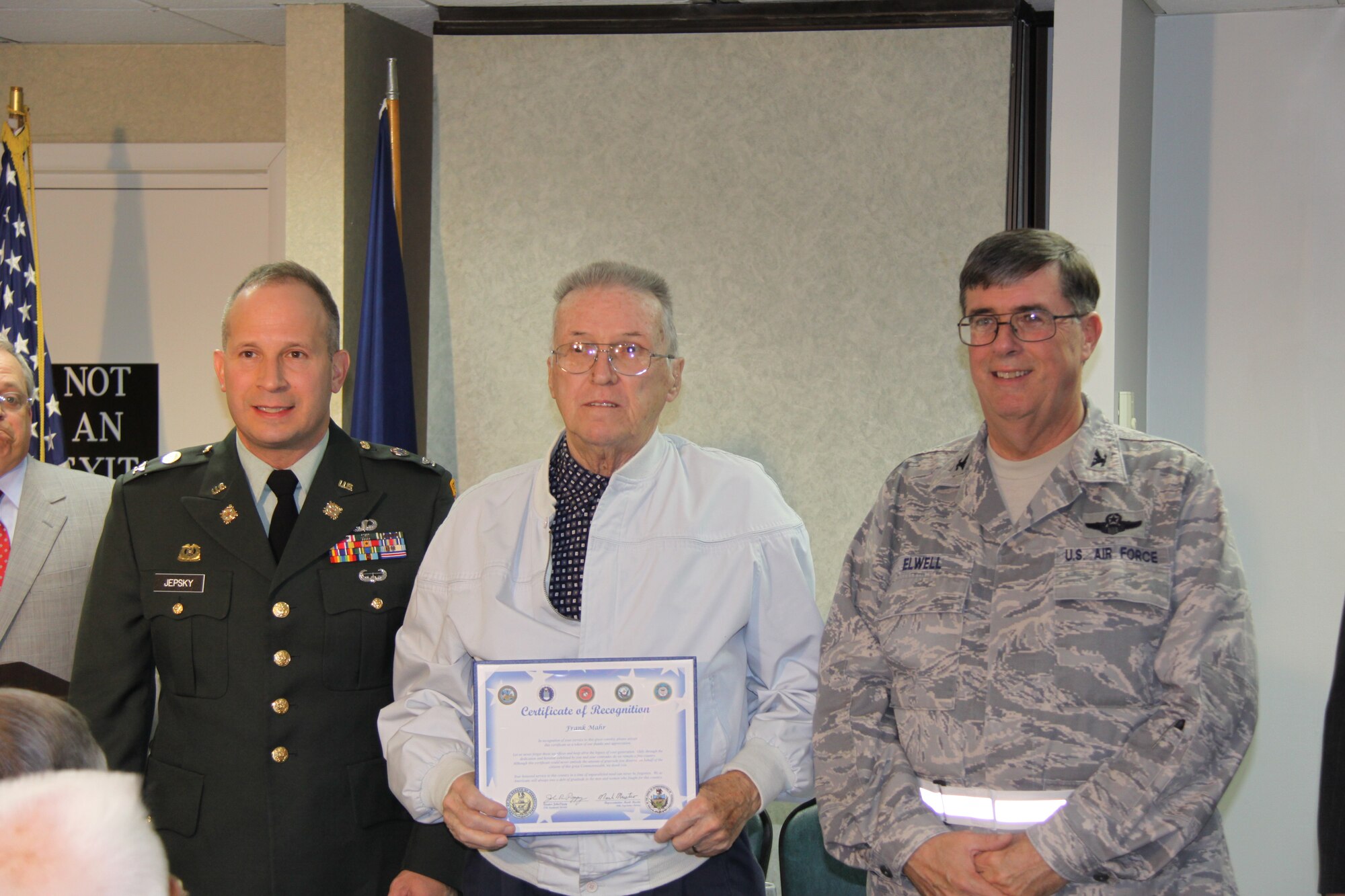 U.S. Army Veteran, Frank Mahr (center) received a certificate of recognition for his participation in the Korean War, from Col. Arthur Jepsky, 316th Expeditionary Sustainment Command commander (left)and Col. Gordon H. Elwell, Jr., 911th Airlift Wing commander (right). The event, sponsored by Pa. State Representative Mark Mustio and Pa. State Senator John Pippy recognized 31 Korean War Veterans and 32 Vietnam War Veterans from the local area, during a recognition ceremony held here, Nov. 13, 2009.   