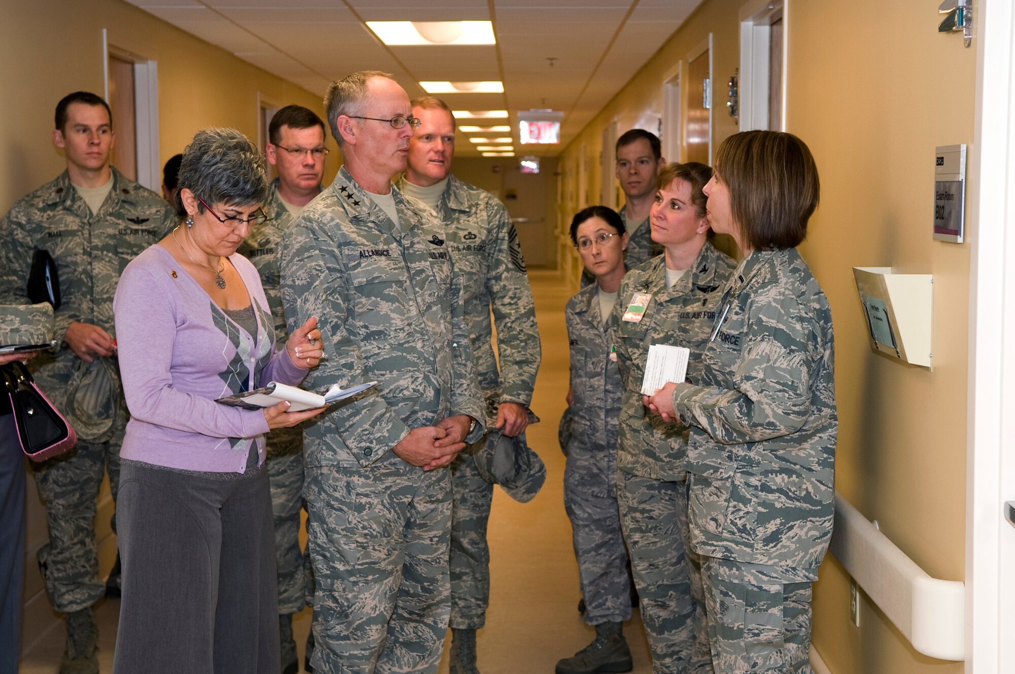 SCOTT AIR FORCE BASE, Ill -- Lt. Gen. Robert R. Allardice, 18th Air Force commander,  and his wife Susan Allardice (left) talk with 1st Lt. Sandra Arsenault, clinical nurse for the 375th Medical Operations Squadron(right) and Col. Pennie Parlisin, 375th Medical Operations Squadron commander about the inner workings of the OB/GYN clinic Nov. 24. Gen. Allardice visited various sections of the medical group during his two-day visit to Scott AFB. (U.S. Air Force photo by Senior Airman Teresa M. Jennings)