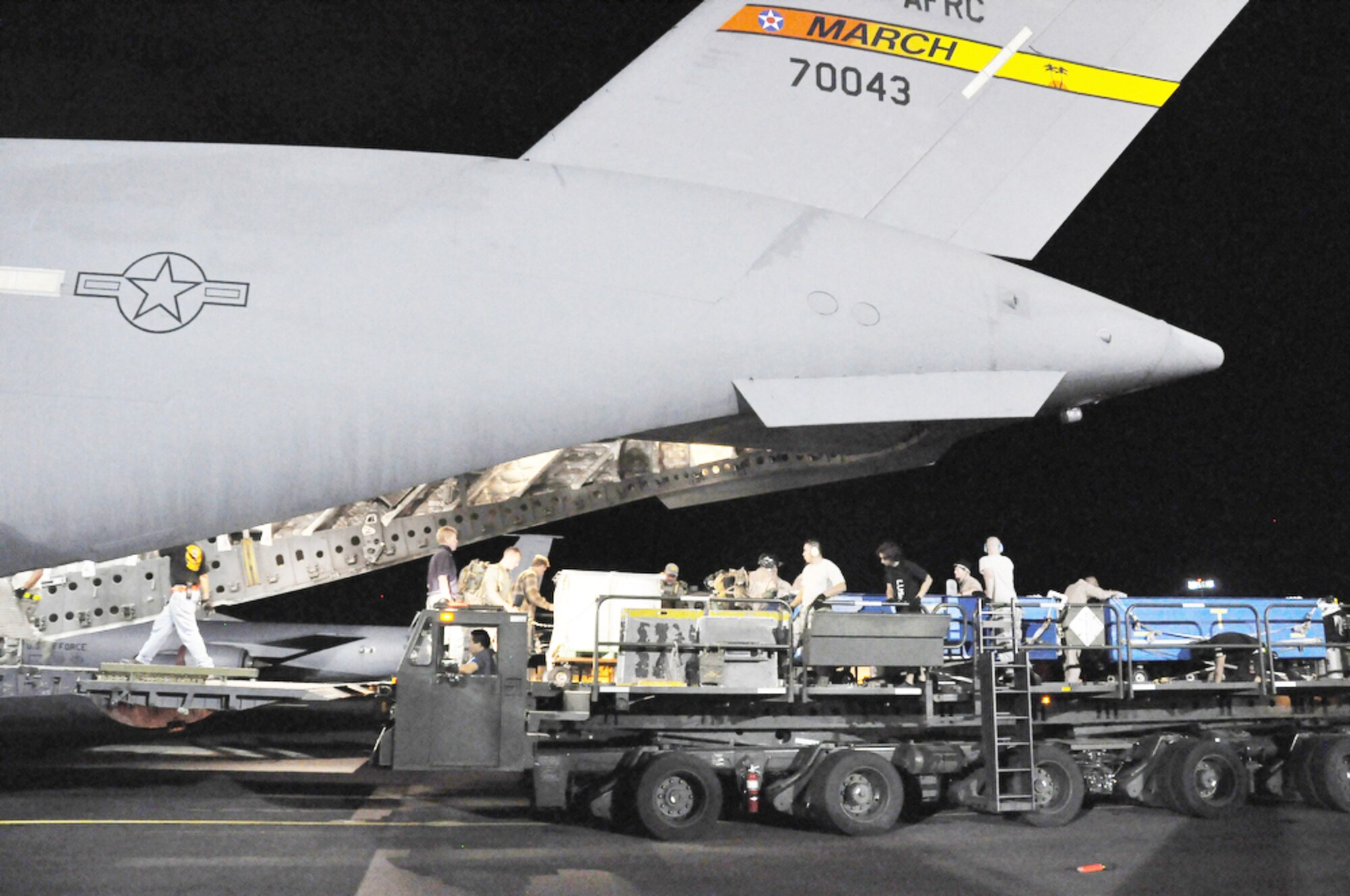 Transportation planners are working closely with operations specialists to accomplish the mission of delivering 30,000 U.S. troops and equipment to Afghanistan when they are needed.  They will use C-17 Globemaster IIIs, like the one shown here, as well as C-5 Galaxy aircraft to move outsized military equipment into the area of responsibility. (Defense Department photo/Tech. Sgt. Cohen A. Young)