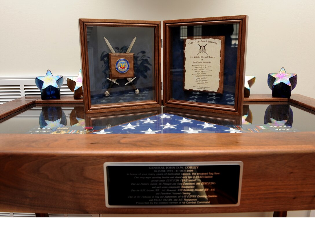 UNION HALL, Va. – Retired Gen. John D. W. Corley, former commander of Air Combat Command, displays his Order of the Sword induction ceremony invitation atop a shadow box he received during his retirement ceremony in September. The Order of the Sword induction ceremony, which is the highest honor enlisted men and women can bestow upon an officer, is Jan. 13. (U.S. Air Force photo/Airman Rebecca Montez)