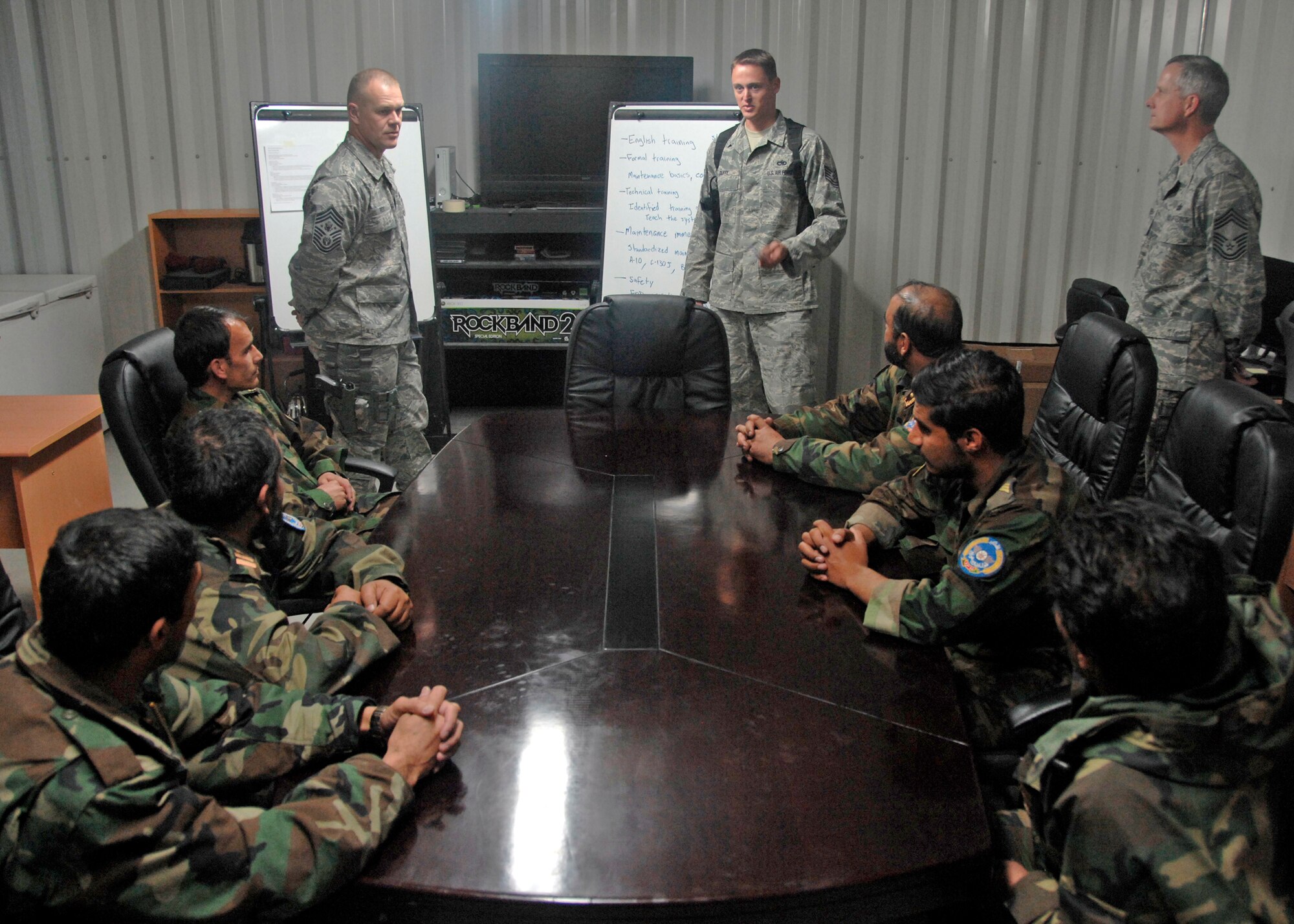 Chief Master Sgt. of the Air Force James A. Roy visited the Afghan National Army Air Corps during his visit Nov. 29, 2009 at Kandahar Airfield, Afghanistan. Airmen from the 451st Air Expeditionary Wing assist and mentor the Afghan servicemembers with developing and standardizing lesson training plans and on-the-job-training records. (U.S. Air Force photo/Senior Airman Timothy Taylor)