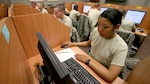 Airmen from the 344th Training Squadron take a test at Lackland's newly expanded national testing center. The center added 11 testing stations and now offers professional military education testing at no cost. (U.S. Air Force photo/Robbin Cresswell)