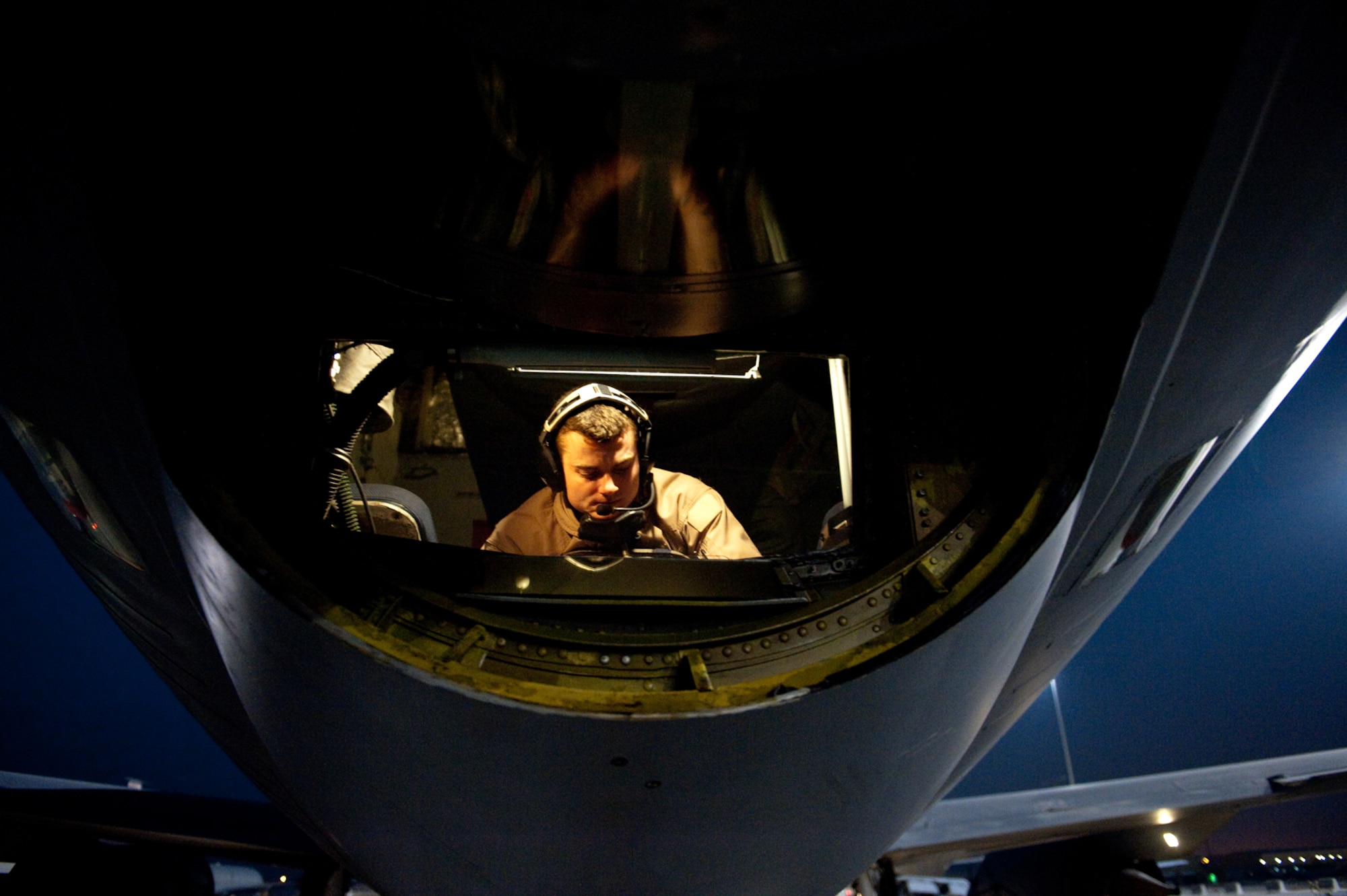 SOUTHWEST ASIA - Senior Airman Andrew Deck, 340th Expeditionary Air Refueling Squadron boom operator, conducts a KC-135 Stratotanker preflight check, Dec. 2, 2009, in Southwest Asia. The 340 EARS Airmen fly a variety of missions providing aerial refueling of U.S. and Coalition aircraft throughout the U.S. Central Command area of responsibility in support of operations Iraqi Freedom and Enduring Freedom. (U.S. Air Force photo/Staff Sgt. Robert Barney)