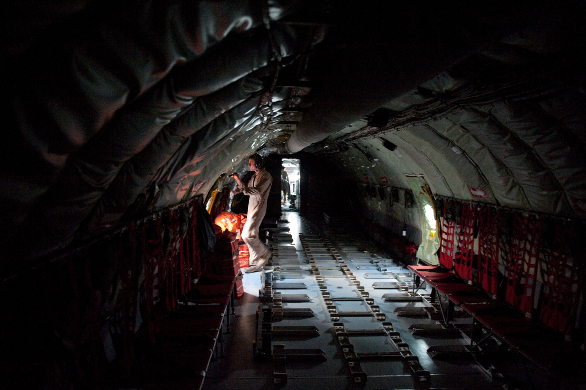 Senior Airman Andrew Deck, 340th Expeditionary Air Refueling Squadron boom operator, conducts a KC-135 Stratotanker preflight check, Dec. 2, 2009, in Southwest Asia. The 340 EARS Airmen fly a variety of missions providing aerial refueling of U.S. and Coalition aircraft throughout the U.S. Central Command area of responsibility in support of operations Iraqi Freedom and Enduring Freedom. (U.S. Air Force photo/Staff Sgt. Robert Barney)