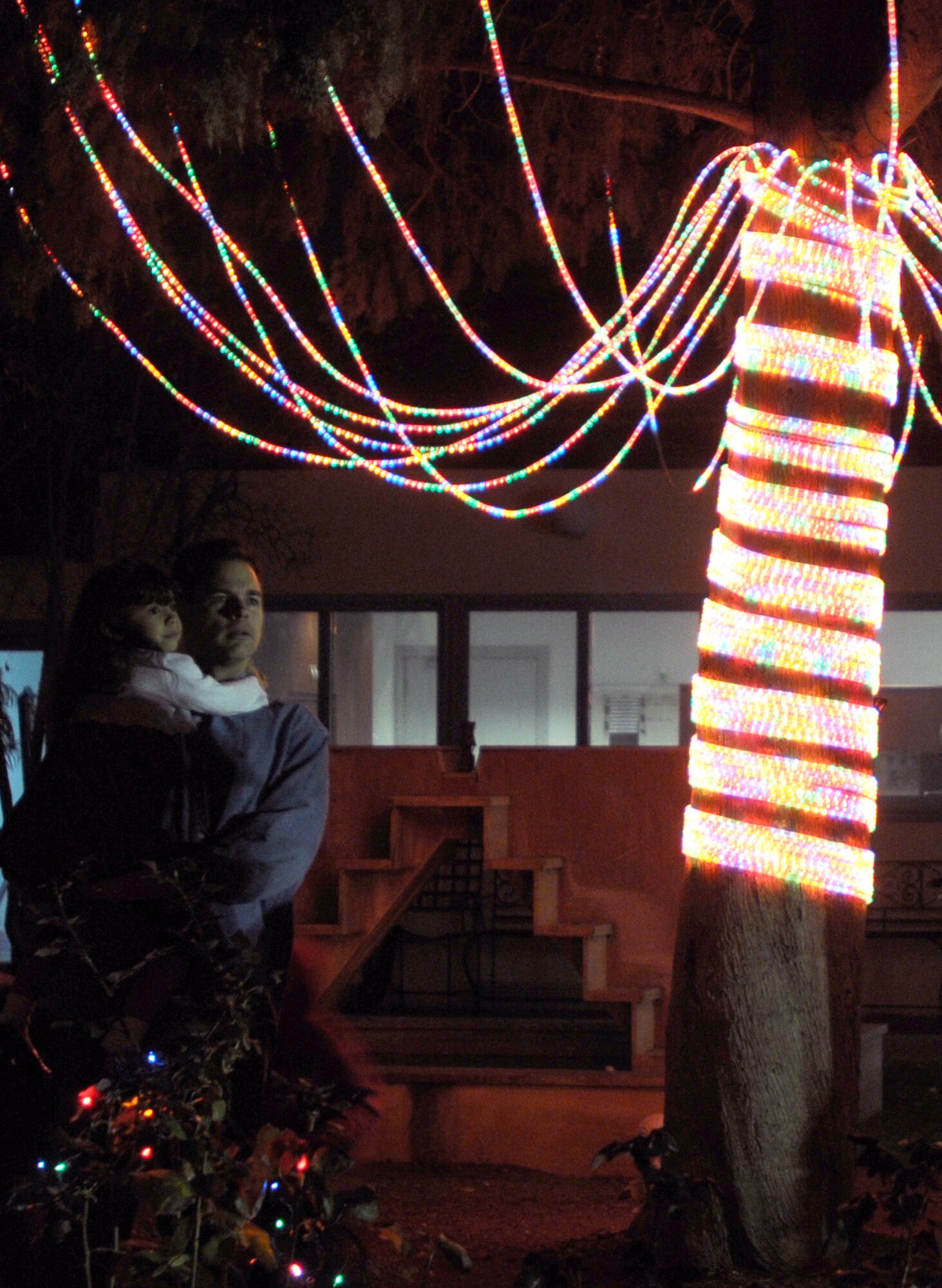 Master Sgt. Christopher Carrico, 39th Force Support Squadron first sergeant, gives his daughter, Ciandra Carrico, a closer look at the base Christmas tree during Incirlik’s tree lighting ceremony Thursday, Dec. 3, 2009 at the base chapel.  The tree lighting ceremony is held every year during the holiday season to bring Airmen and their families together by lighting the base Christmas tree, serving cookies and hot chocolate, and a special visit from Santa.  (U.S Air Force Photo/Senior Airman Ashley Wood)