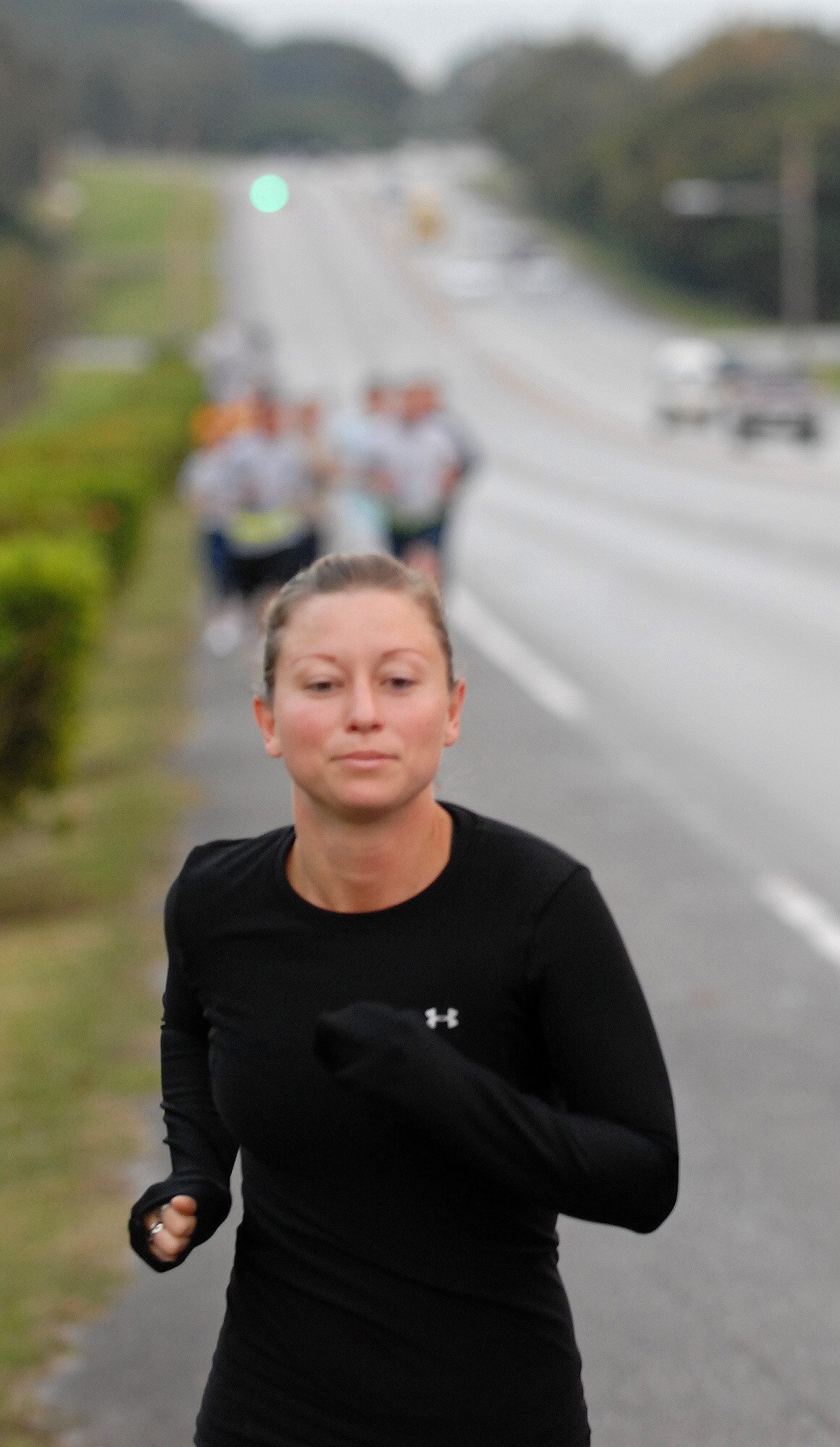 Tech. Sgt. Angelique Perez, 18th Wing public affairs, makes her way up Douglas Boulevard during the Combined Federal Campaign 5K fundraiser run Dec. 4. More than 175 people on island participated in thefundraiser run and raised more than $1,200 for this year’s campaign. The top finishers were: Tomas Sanchez, 18th Civil Engineer Squadron, with a 16:56 run time in the males category and Yoko Stevens with a 19:27 run time in the female category. Brad Davis, Maj. Alan Payton, 82nd Reconnaissance Squadron, Capt. Emily Newman, 18th Aeromedical Evacuation Squadron and Tech. Sgt. Debra Gililland-Swartz, 18th Maintenance Group, were also among the top three finishers. (Air Force/Staff Sgt. Jason Lake)