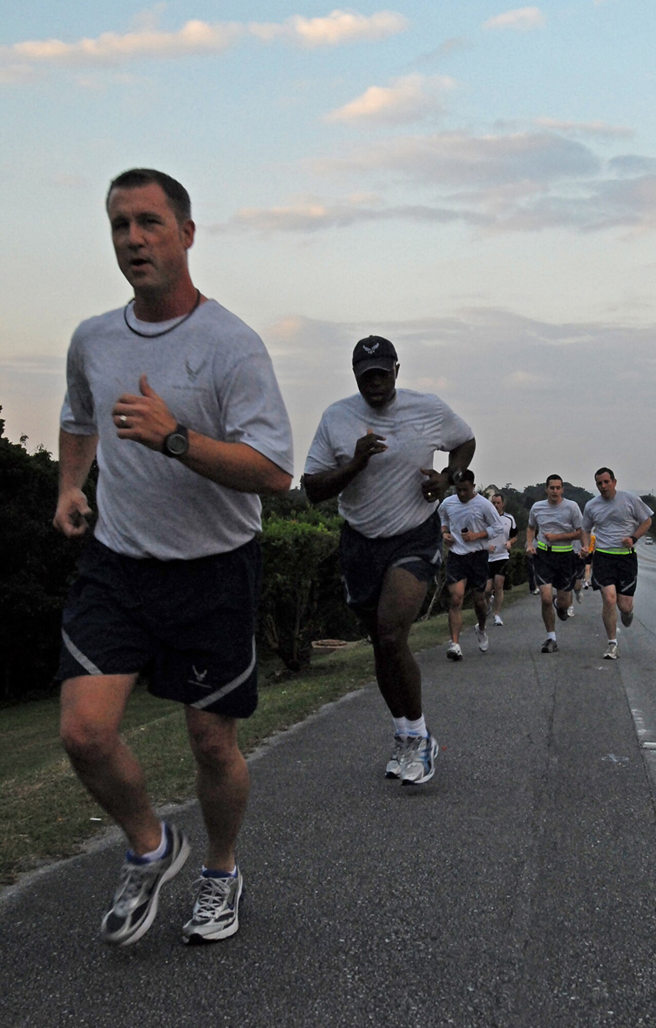 Dozens of runners make their way up Douglas Boulevard's big hill as they gut out the final stretch of a Combined Federal Campaign 5K fundraiser Dec. 4. More than 175 people on island participated in the event that raised more than $1,200 for this year’s campaign. (Air Force/Staff Sgt. Jason Lake)