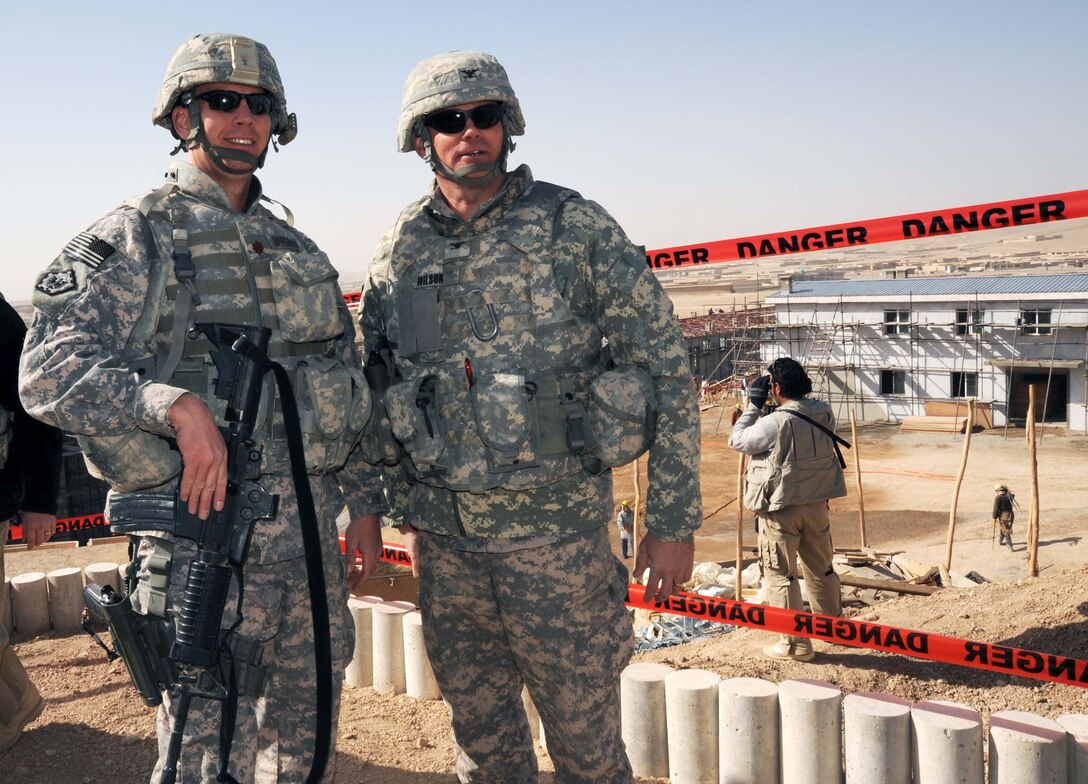 U.S. Army Col. Kevin Wilson, commander of Afghanistan Engineer District – South, right, chats with U.S. Air Force Maj. Bryan Opperman, officer in charge of the Qalat resident office, at the construction site of a new Afghan National Police station. U.S. Army photo by Patricia Ryan 