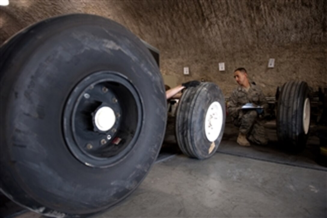 U.S. Air Force Staff Sgt. Marvin Rottenberg, with the wheel and tire shop of the 379th Expeditionary Maintenance Squadron, checks the serial numbers on tires ready to be refurbished at a base in Southwest Asia on Nov. 20, 2009.  The wheel and tire shop refurbishes and maintains wheels and tires for a variety of aircraft operating throughout Southwest Asia.  