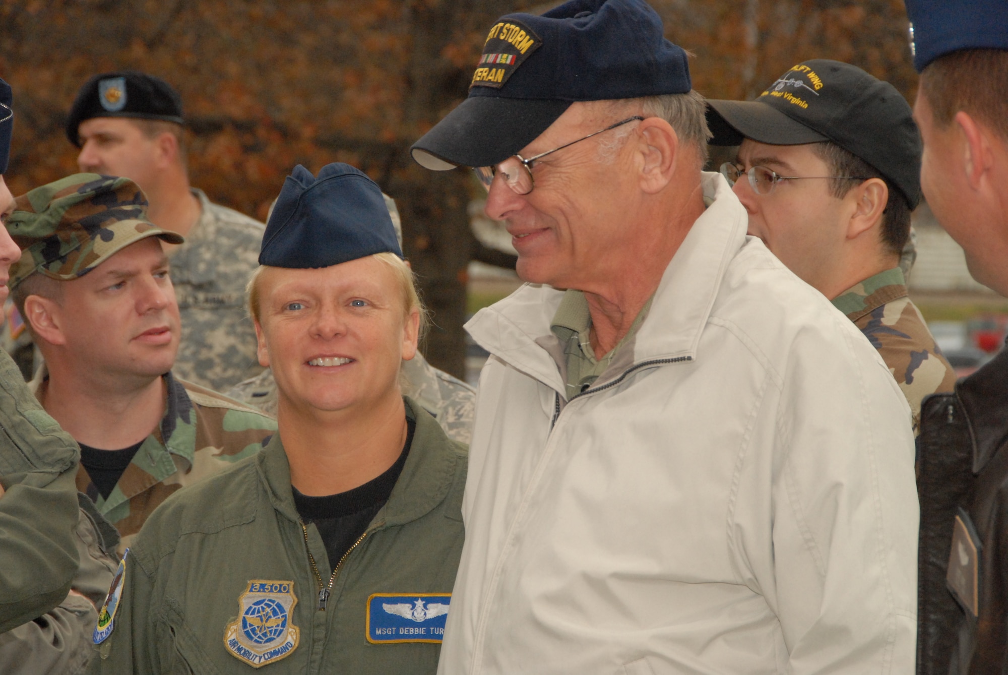 Master Sgt. Debbie Turrill of the 130th Airlift Wing and other Air Guard Members gather around David Strckland, a former unit member, before the rededication ceremony of the Veterans Memorial in Charleston, W.Va., Tuesday, Nov. 10, 2009. (U.S. Air Force photo by Tech. Sgt. Phyllis E. Keith/Released)