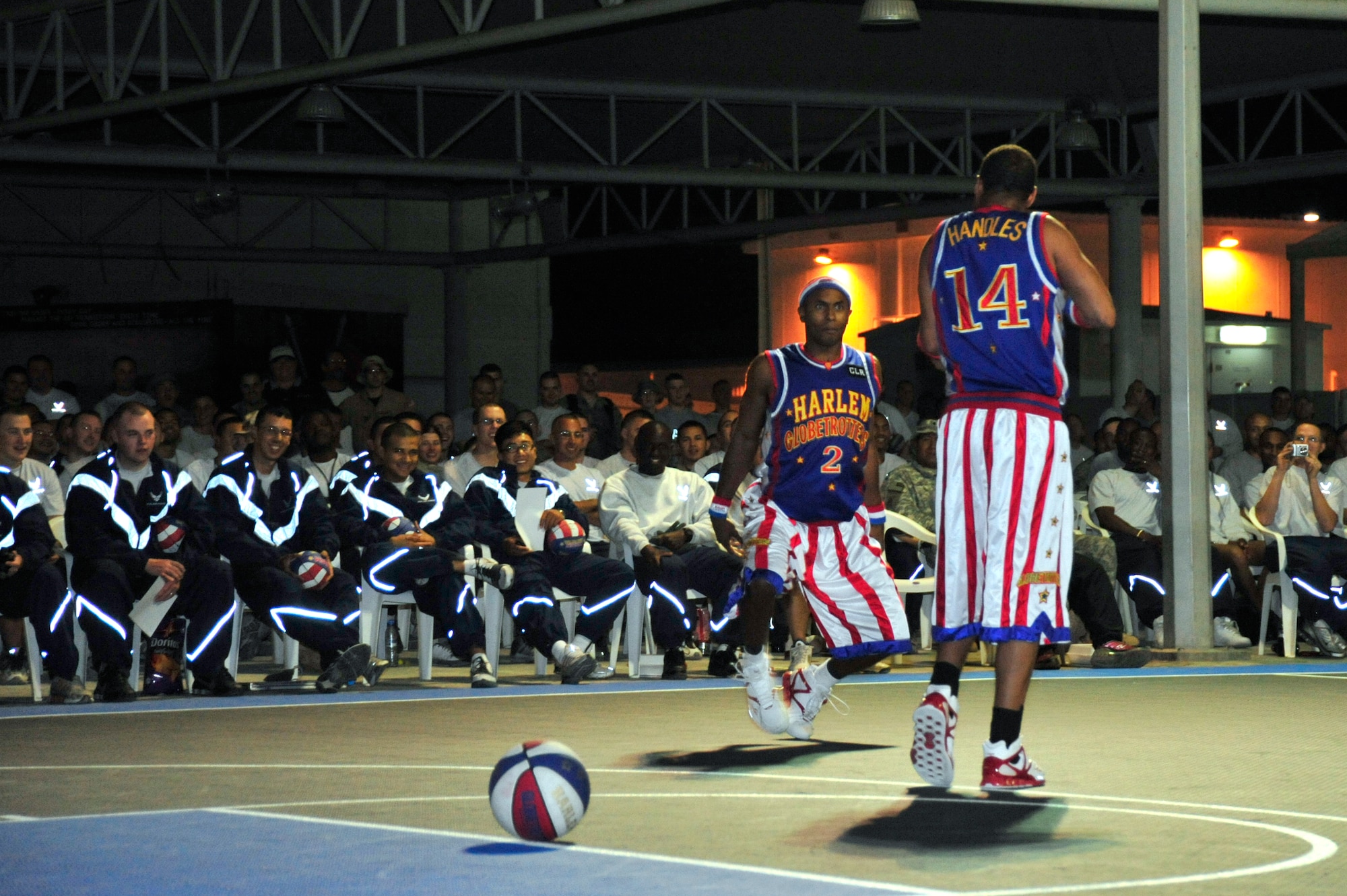 SOUTHWEST ASIA - "Dizzy" Grant and "Handles" Franklin of the Harlem Globetrotters, perform a skit for the Airmen of the 380th Air Expeditionary Wing Dec. 4, 2009. The Globetrotters performed courtesy of the Armed Forces Entertainment while touring 10 countries in Southwest Asia. (U.S. Air Force photo/Tech. Sgt. Charles Larkin Sr)